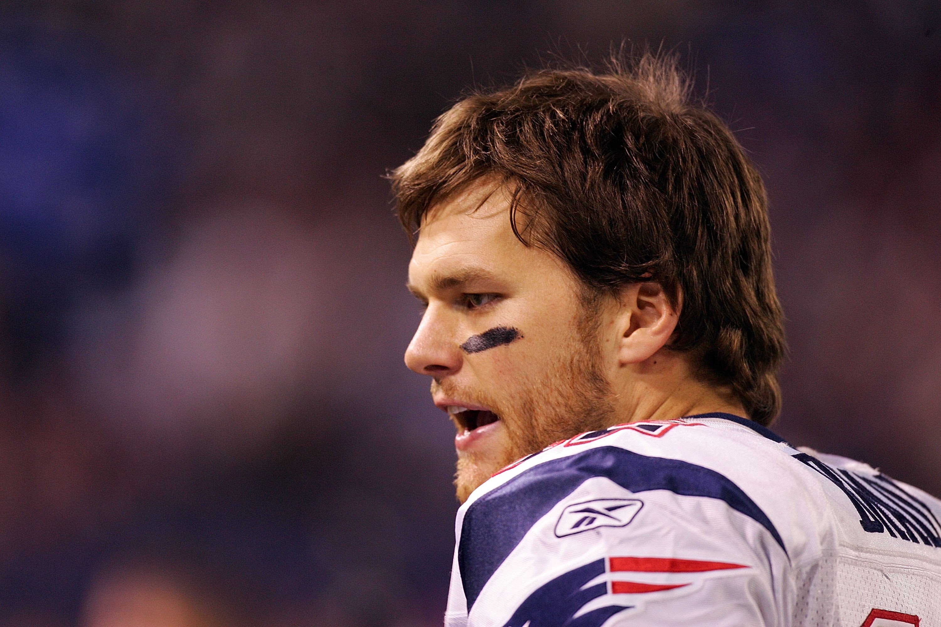 EAST RUTHERFORD, NJ - DECEMBER 29:  Tom Brady #12 of the New England Patriots looks on from the sidelines against the New York Giants on December 29, 2007 at Giants Stadium in East Rutherford, New Jersey.  (Photo by Jim McIsaac/Getty Images)