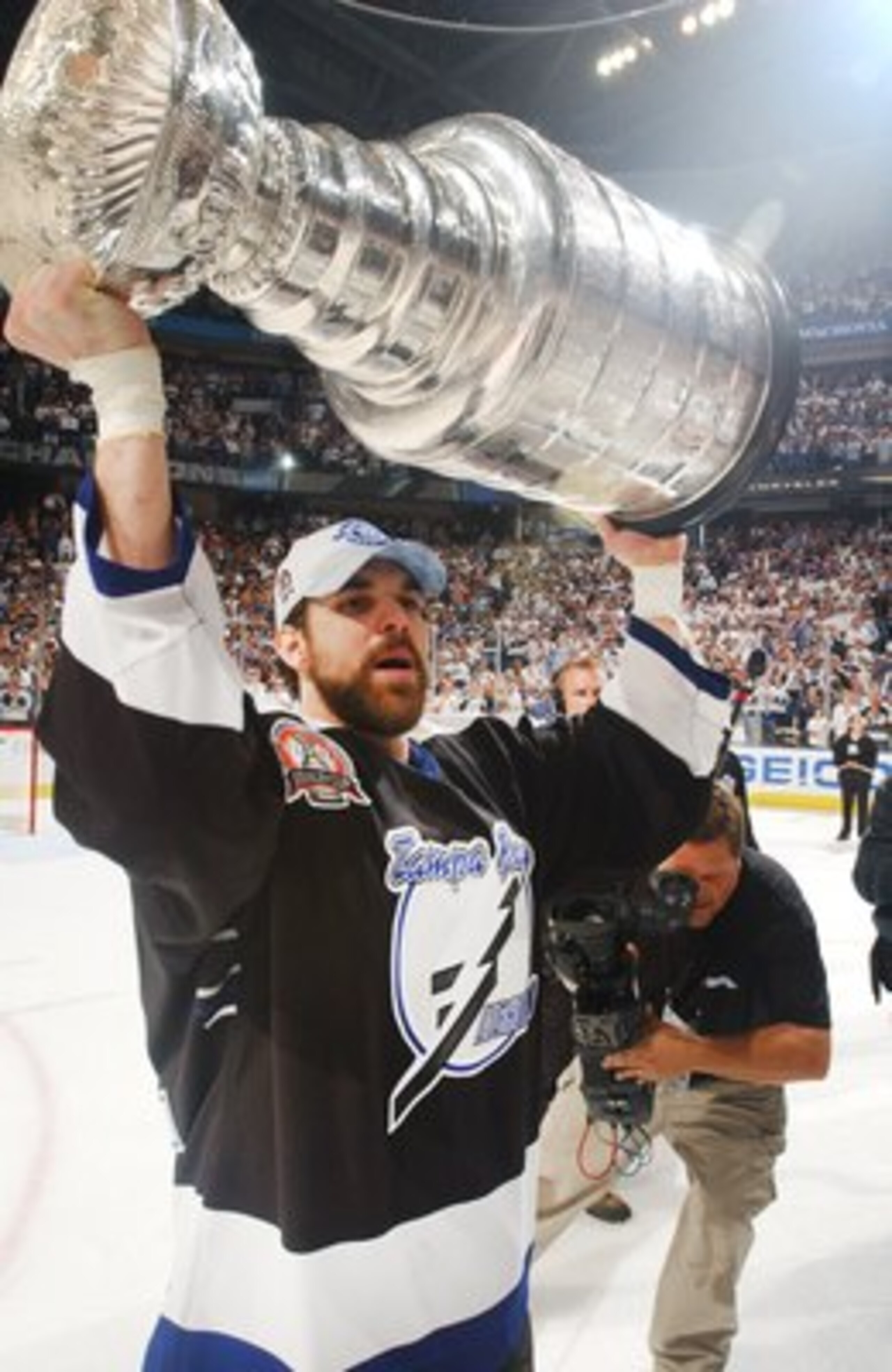 TAMPA, FL - JUNE 7:  Dan Boyle #22 of the Tampa Bay Lightning celebrates the Stanley Cup win against the Calgary Flames on June 7, 2004 at the St. Pete Times Forum in Tampa, Florida. (Photo by Dave Sandford/Getty Images)