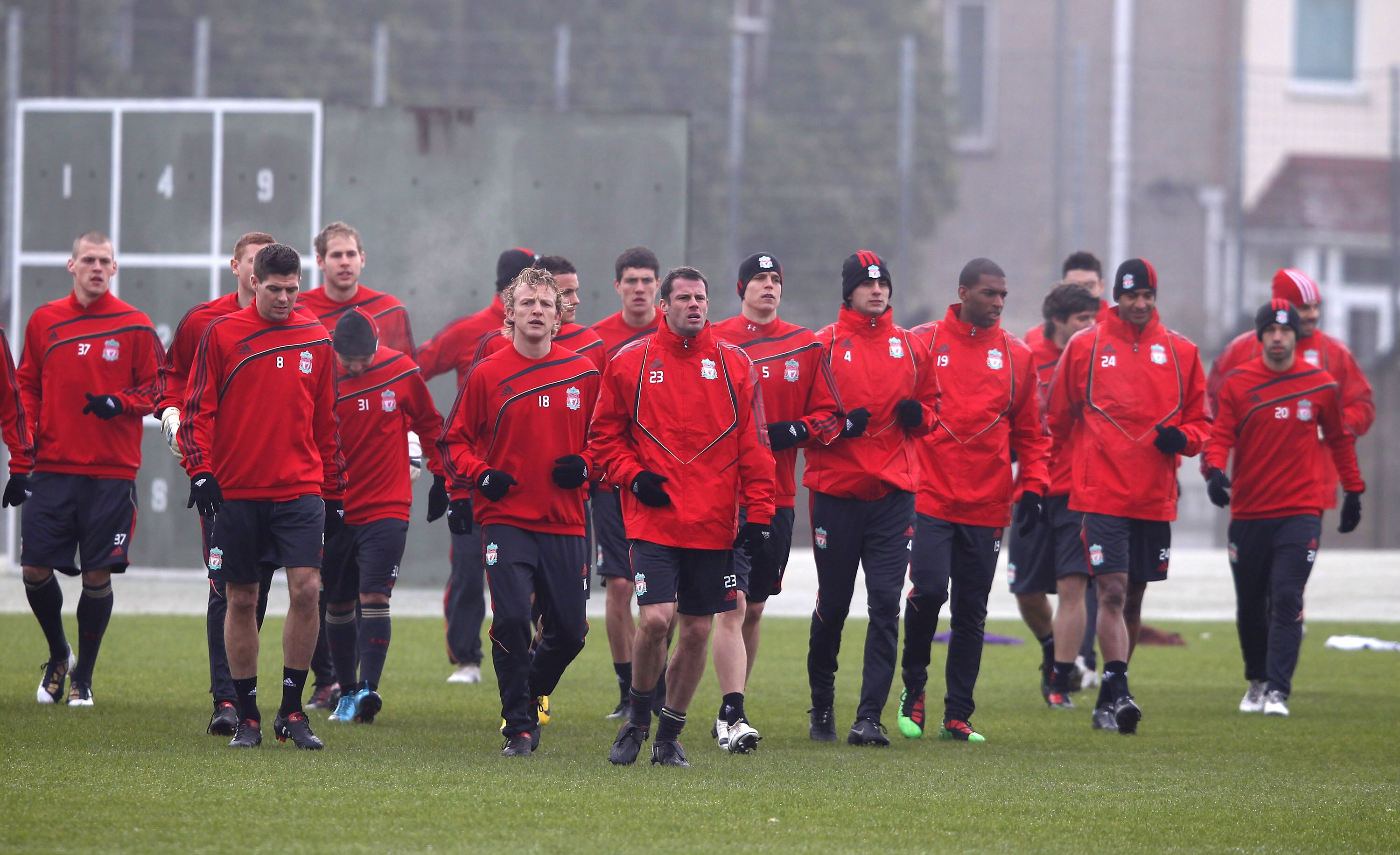LIVERPOOL, ENGLAND - FEBRUARY 17:  The Liverpool squad warm up during a training session prior to the UEFA Europa League round of 32 first-leg match between Liverpool and Unirea Urziceni at Melwood training ground on February 17, 2010 in Liverpool, Englan