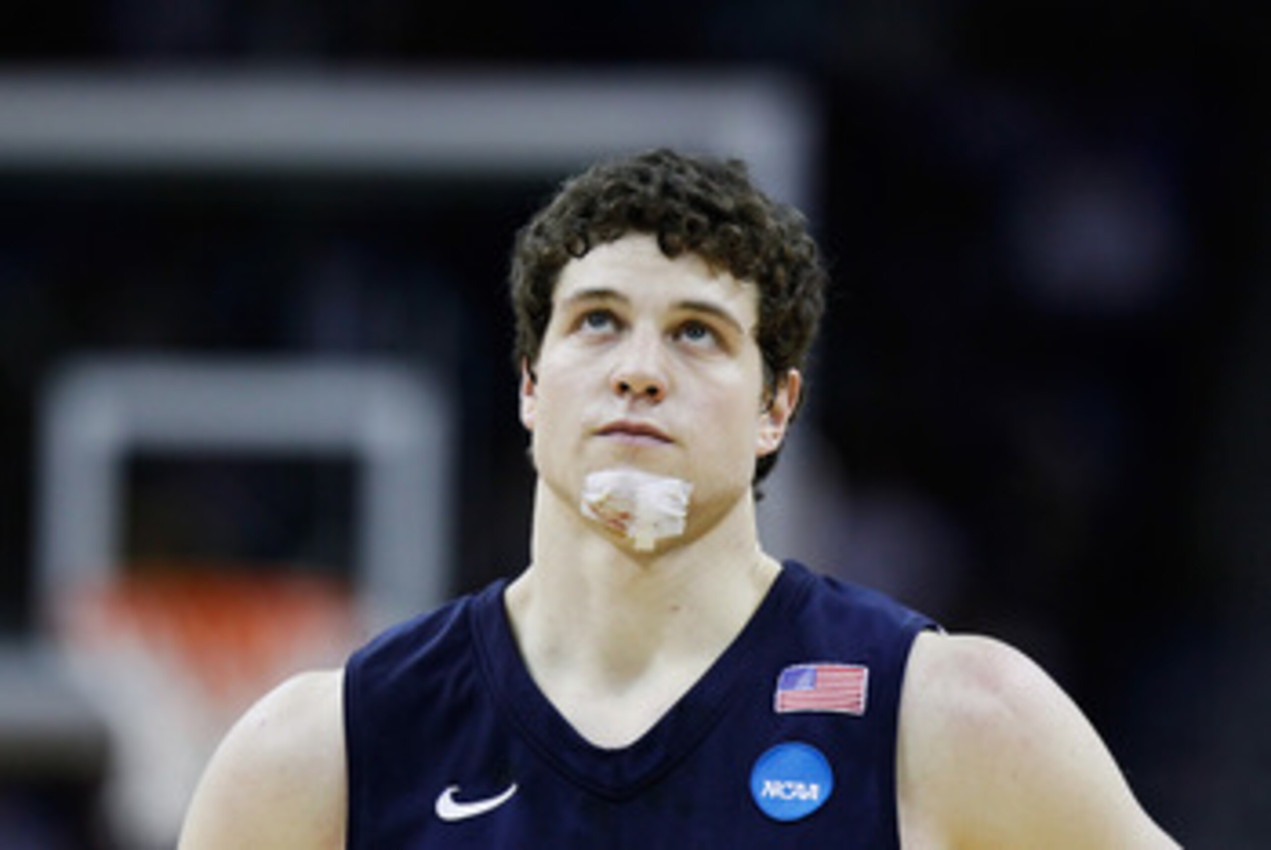 NEW ORLEANS, LA - MARCH 24:  Jimmer Fredette #32 of the Brigham Young Cougars looks on with a bandage on his chin during the second half against the Florida Gators during the Southeast regional of the 2011 NCAA men's basketball tournament at New Orleans A