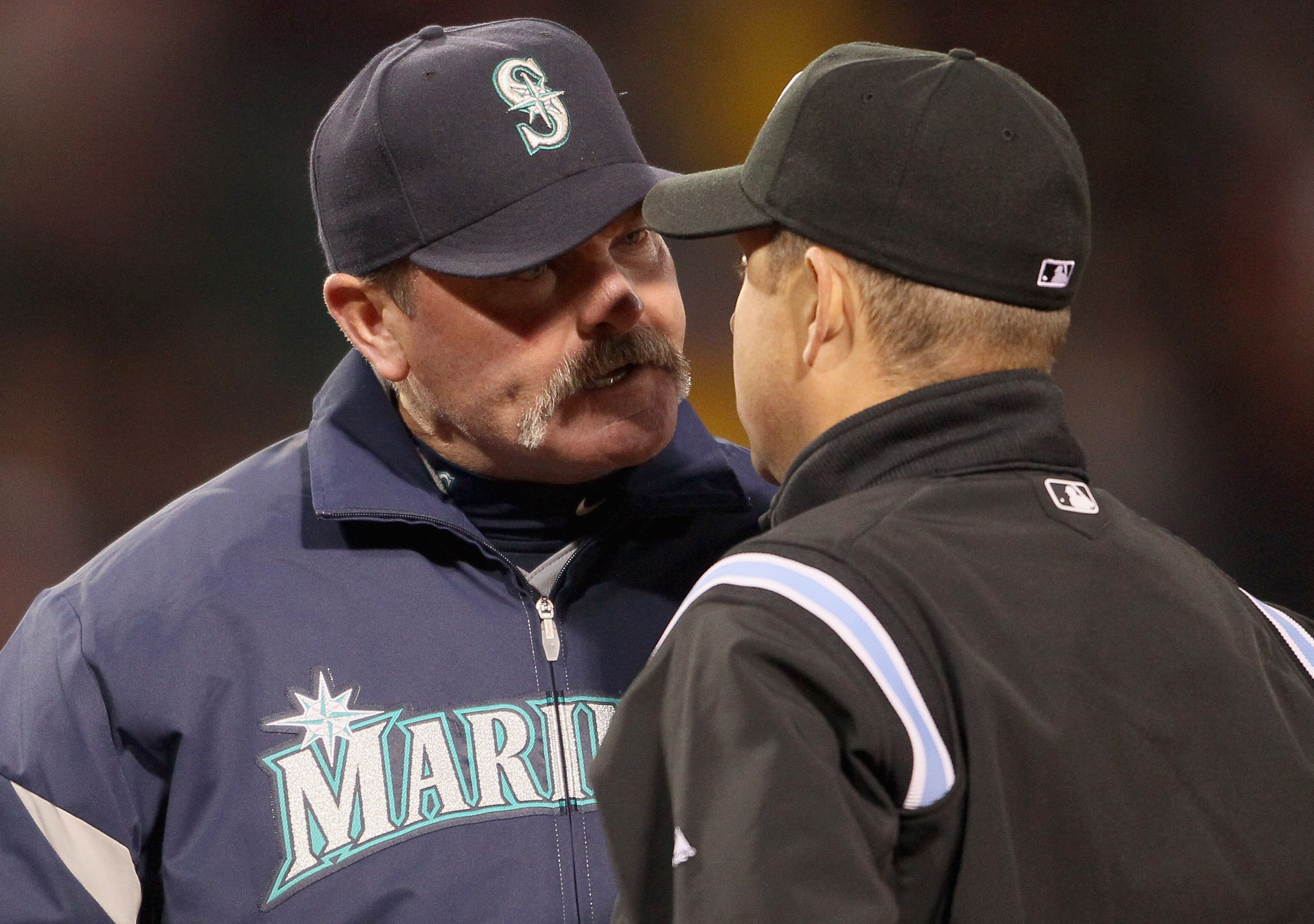 BOSTON, MA - APRIL 30:  Manager Eric Wedge of the Seattle Mariners argues with Todd Tichenor#97 after Miguel Olivo of the Seattle Mariners was called out at first base in the third inning against the Boston Red Sox on April 30, 2011 at Fenway Park in Bost