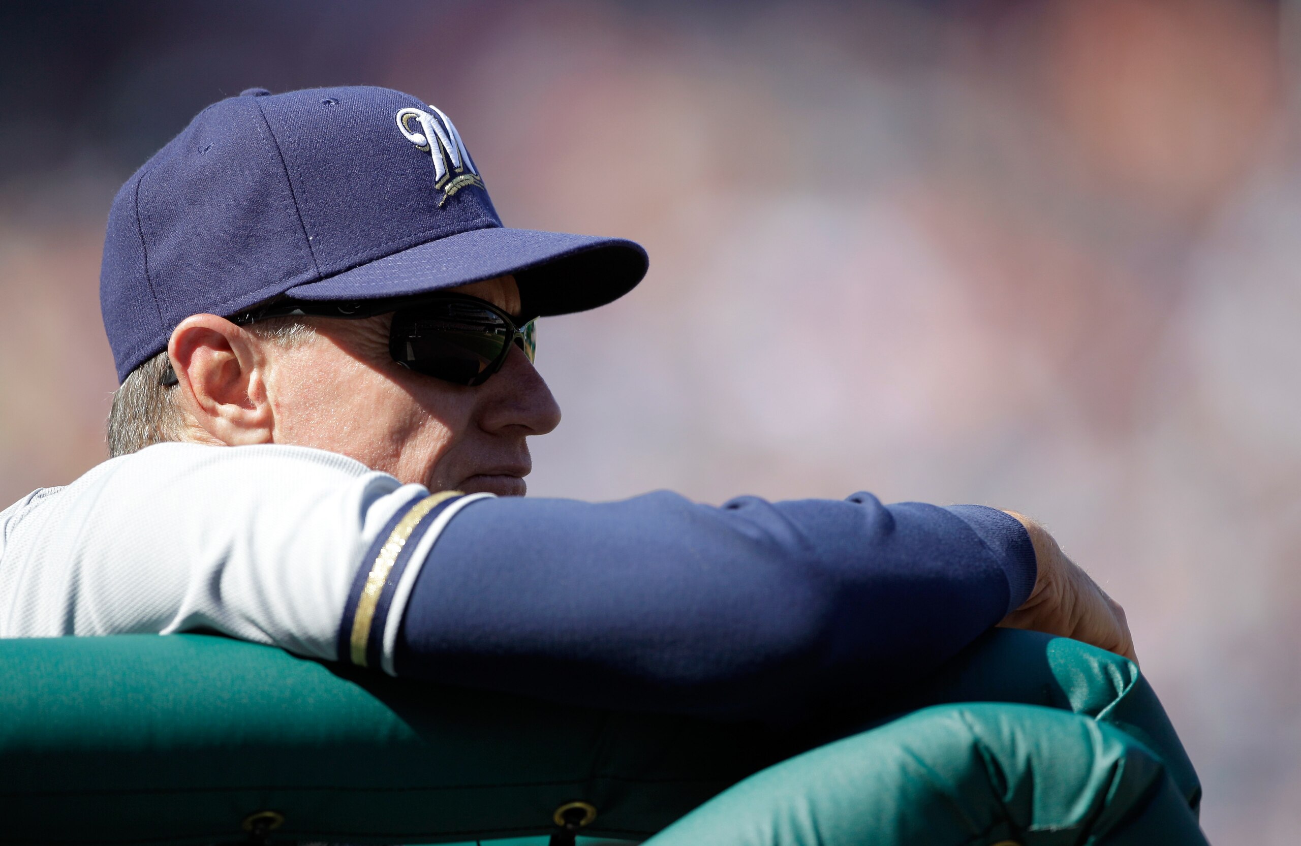 WASHINGTON, DC - APRIL 17: Manager  Ron Roenicke #10 of the Milwaukee Brewers looks on from the dugout against the Washington Nationals during the first game of a doubleheader at Nationals Park on April 17, 2011 in Washington, DC.  (Photo by Rob Carr/Gett