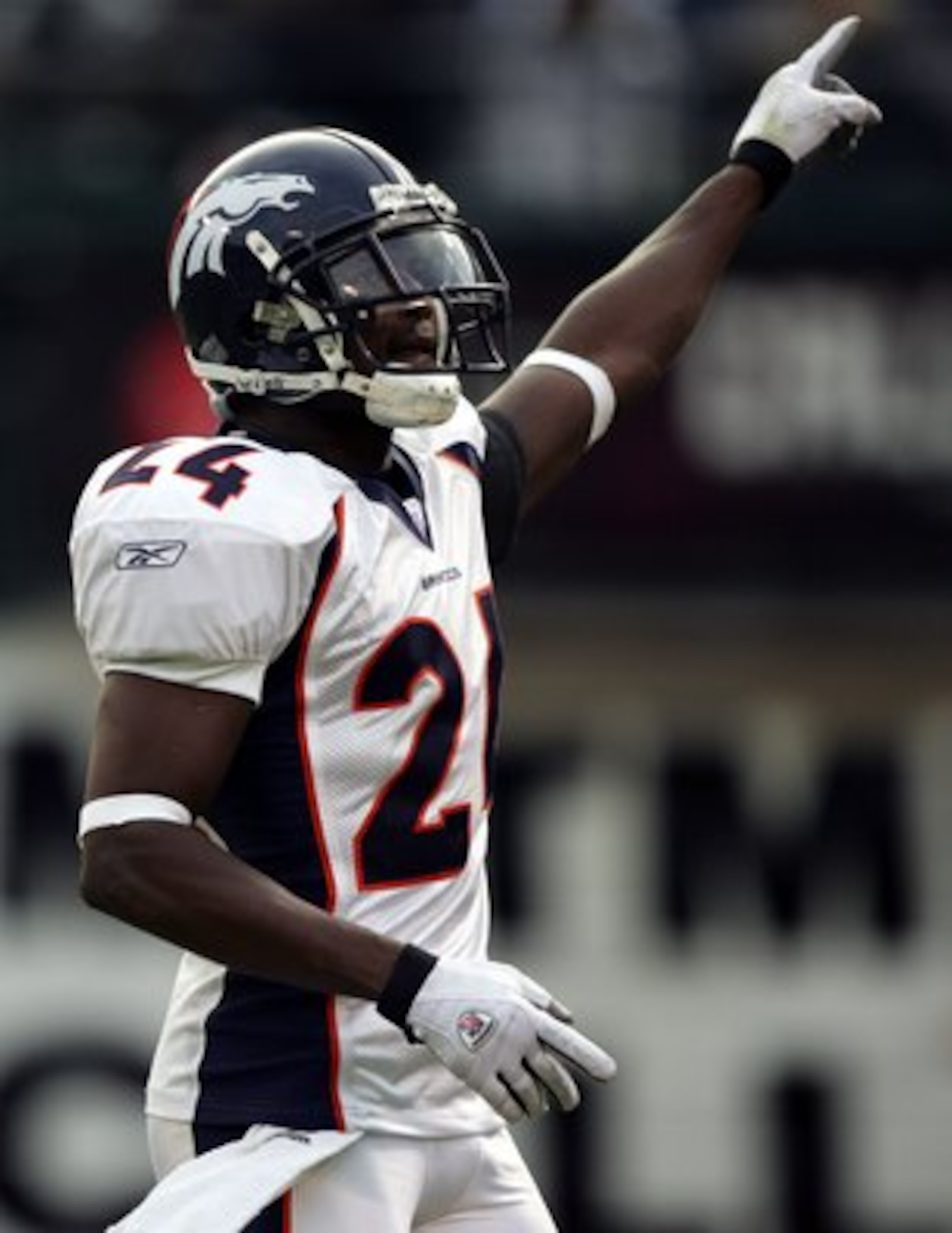 OAKLAND, CA - NOVEMBER 12:  Champ Bailey #24 of the Denver Broncos celebrates after a turnover against the Oakland Raiders during the NFL game at McAfee Coliseum on November 12, 2006 in Oakland, California.  (Photo by Jed Jacobsohn/Getty Images)