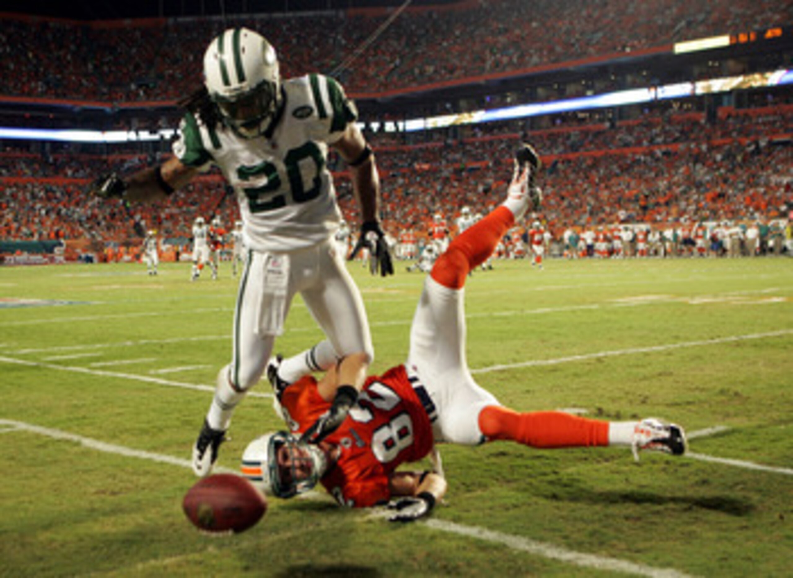 MIAMI - SEPTEMBER 26:  Cornerback Kyle Wilson #20 of the New York Jets is called for pass interference on Receiver Brian Hartline #82 of the Miami Dolphins at Sun Life Stadium on September 26, 2010 in Miami, Florida.  (Photo by Marc Serota/Getty Images)