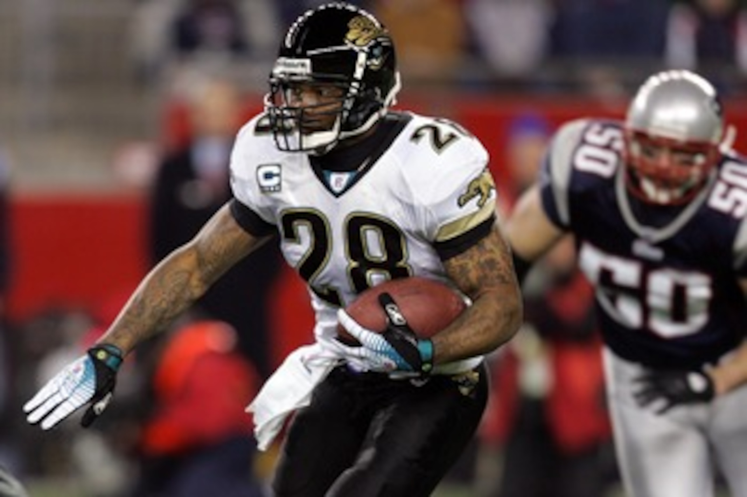 FOXBOROUGH, MA - JANUARY 12: Fred Taylor #28 of the Jacksonville Jaguars runs the ball against the New England Patriots during the AFC Divisional playoff game at Gillette Stadium game on January 12, 2008 in Foxboro, Massachusetts.  (Photo by Jim McIsaac/G