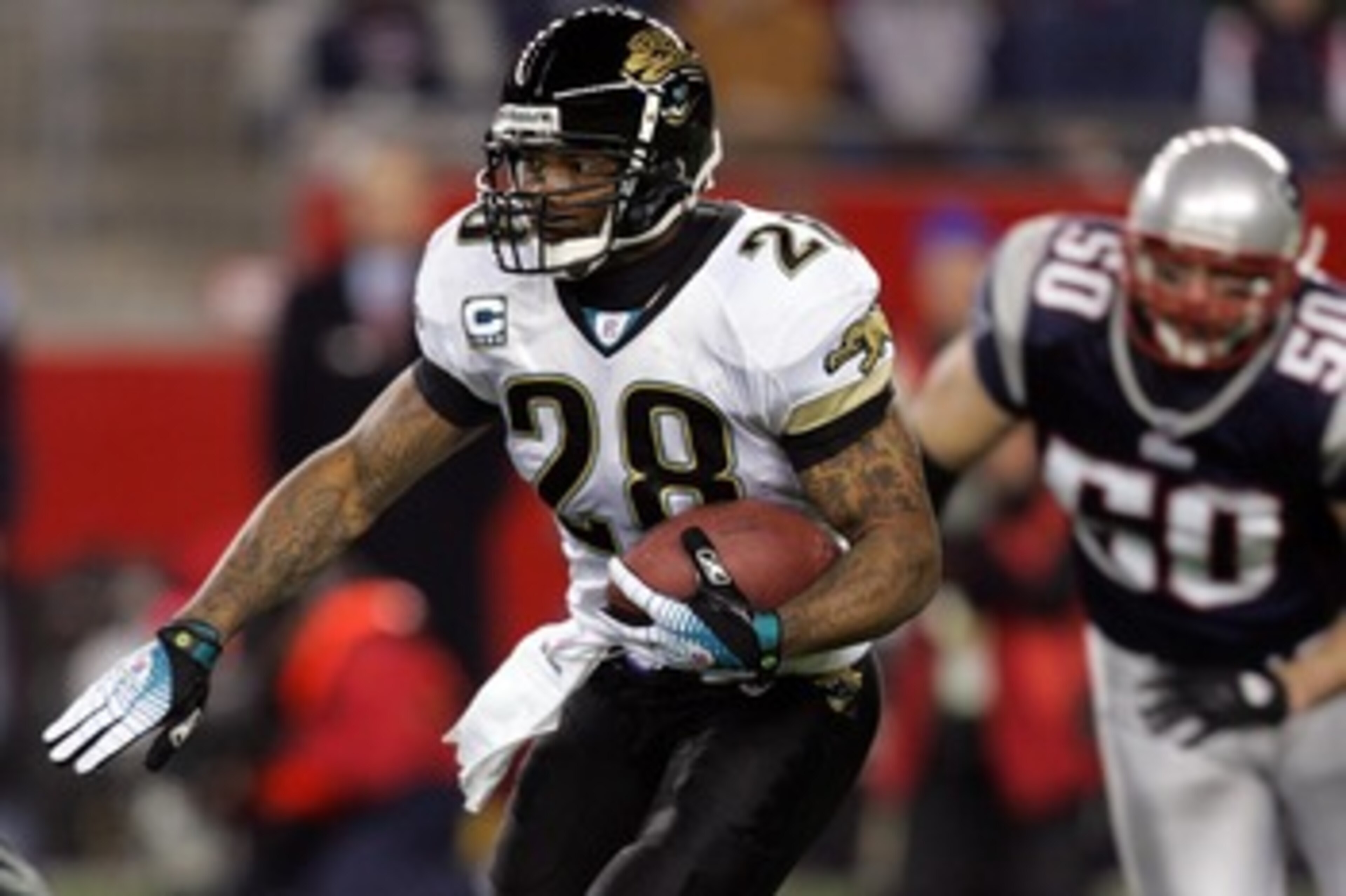 FOXBOROUGH, MA - JANUARY 12: Fred Taylor #28 of the Jacksonville Jaguars runs the ball against the New England Patriots during the AFC Divisional playoff game at Gillette Stadium game on January 12, 2008 in Foxboro, Massachusetts.  (Photo by Jim McIsaac/G