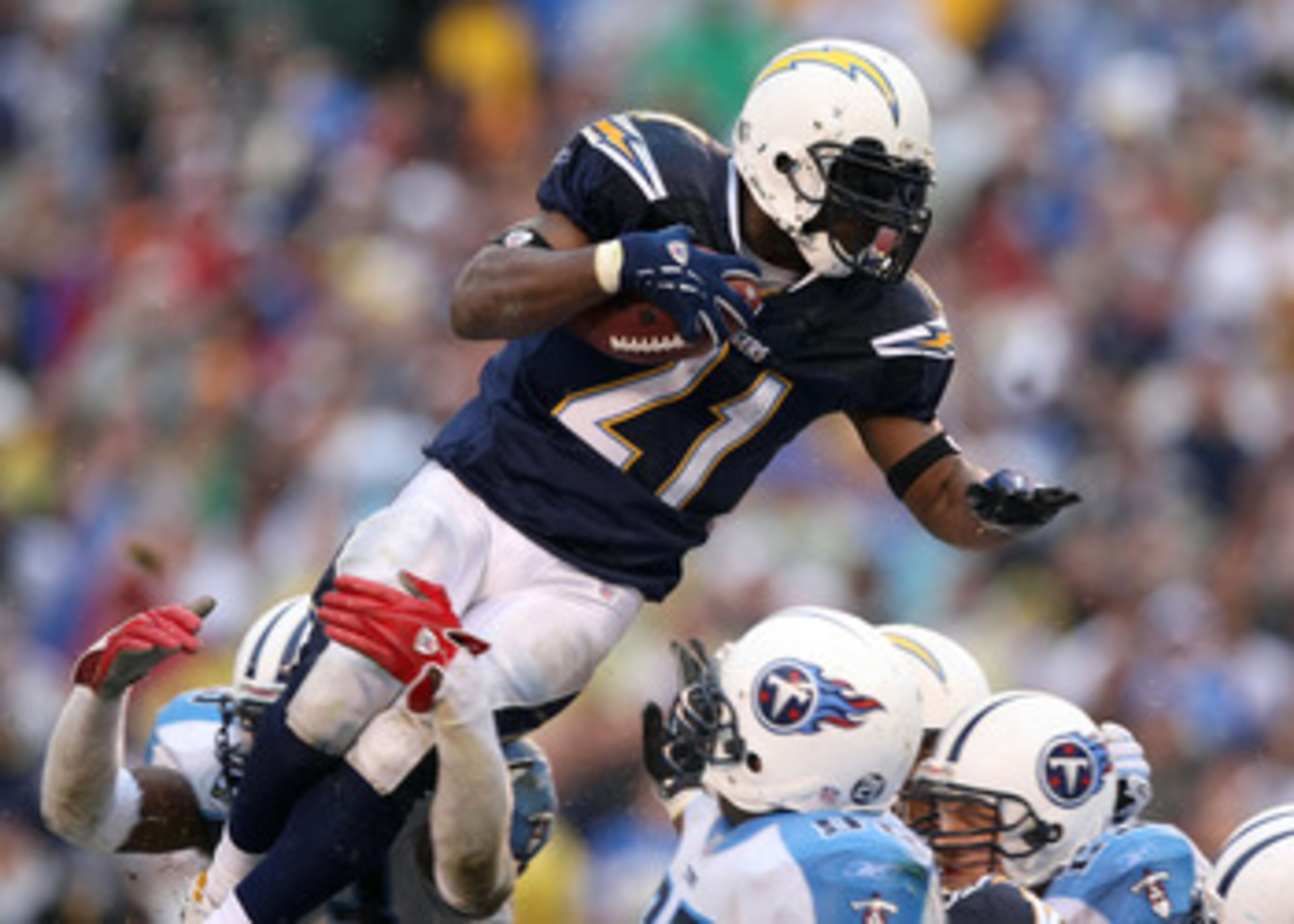 SAN DIEGO - JANUARY 06:  LaDainian Tomlinson #21 of the San Diego Chargers jumps toward the end zone en route to a touchdown in the fourth quarter against the Tennessee Titans during their AFC Wild Card Playoff Game at Qualcomm Stadium on January 6, 2008