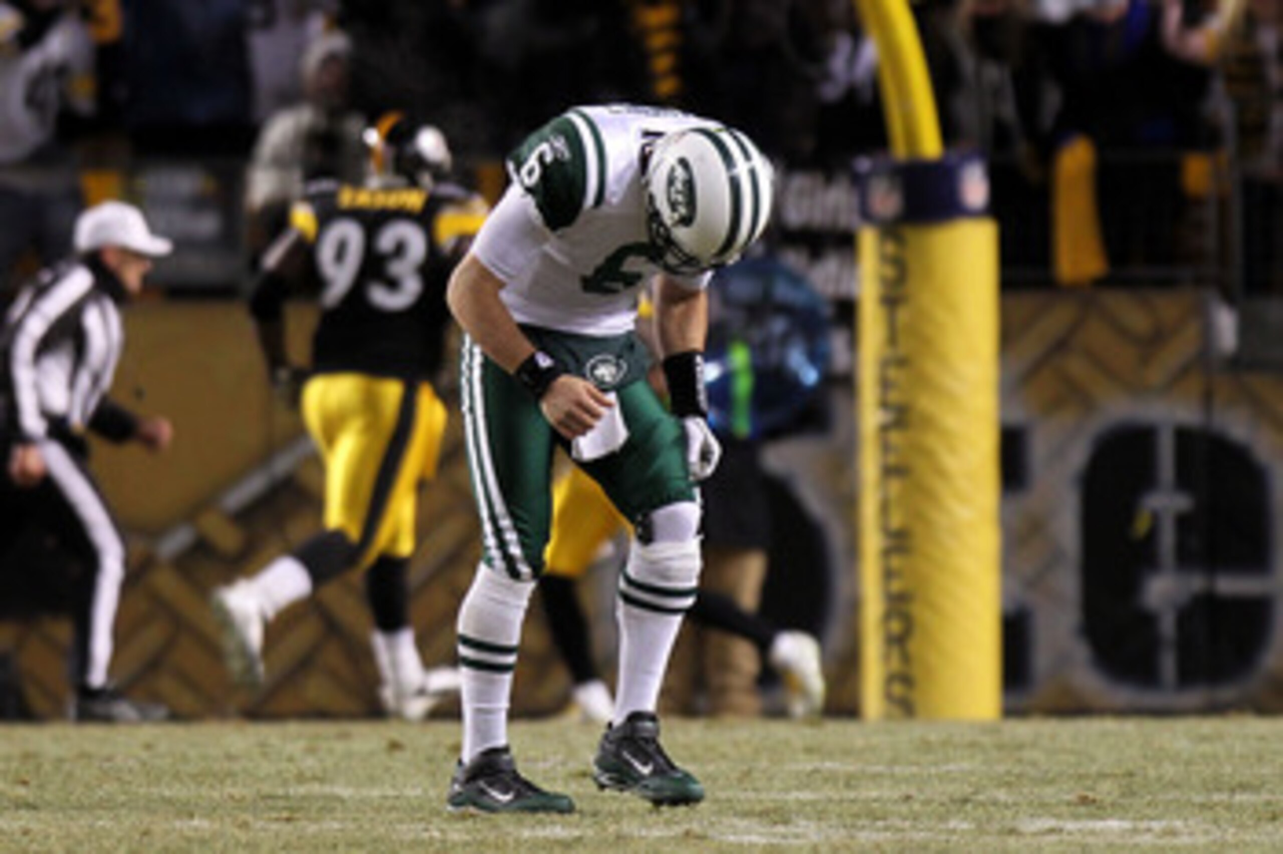 PITTSBURGH, PA - JANUARY 23:  Quarterback Mark Sanchez #6 of the New York Jets walks towards the sideline in pain against the Pittsburgh Steelers during the 2011 AFC Championship game at Heinz Field on January 23, 2011 in Pittsburgh, Pennsylvania. The Ste