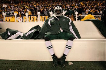 PITTSBURGH, PA - JANUARY 23:  Joe McKnight #25 of the New York Jets sits dejected after being defeated 24 to 19 by the Pittsburgh Steelers in the 2011 AFC Championship game at Heinz Field on January 23, 2011 in Pittsburgh, Pennsylvania.  (Photo by Al Bell