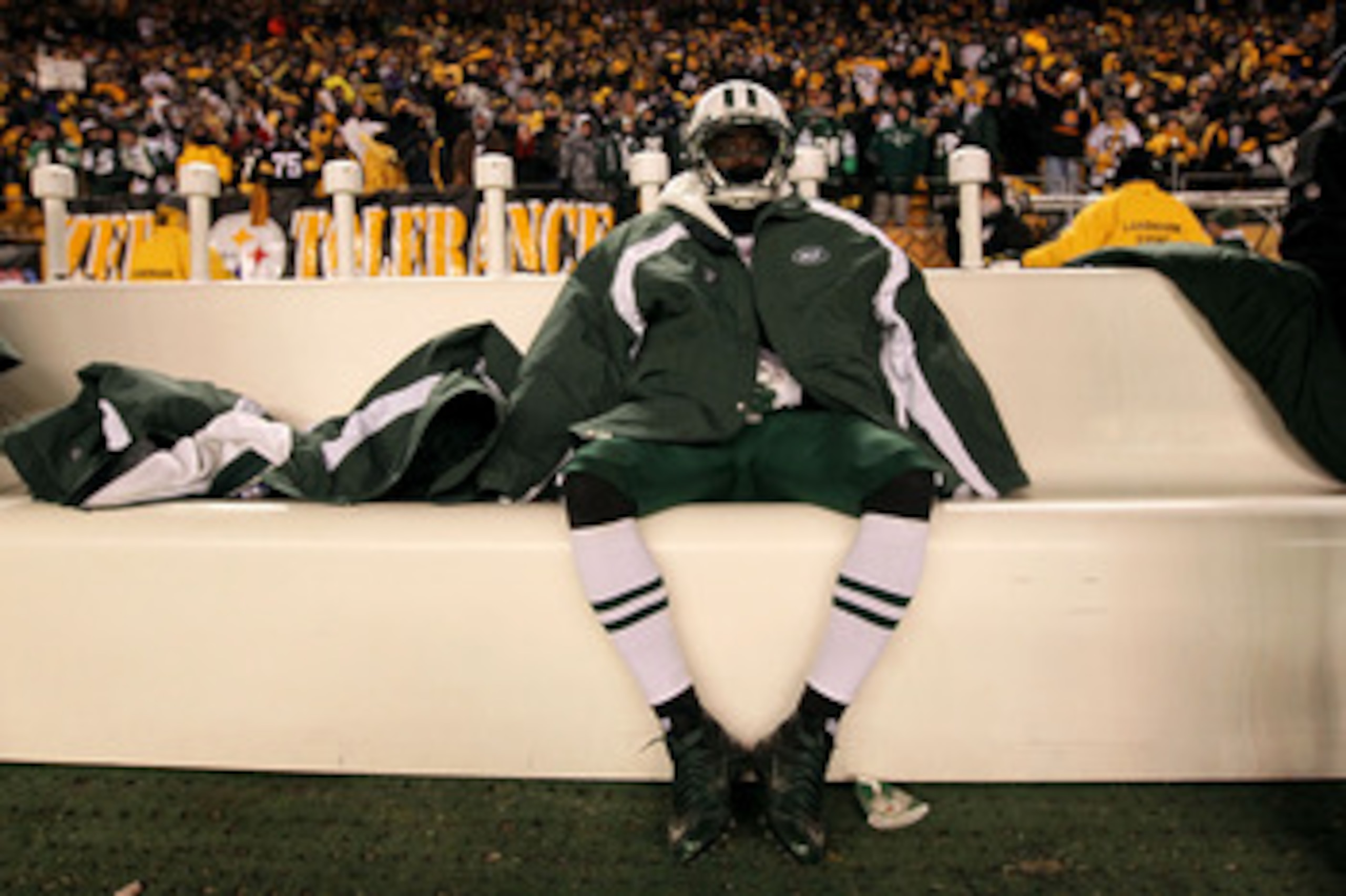 PITTSBURGH, PA - JANUARY 23:  Joe McKnight #25 of the New York Jets sits dejected after being defeated 24 to 19 by the Pittsburgh Steelers in the 2011 AFC Championship game at Heinz Field on January 23, 2011 in Pittsburgh, Pennsylvania.  (Photo by Al Bell