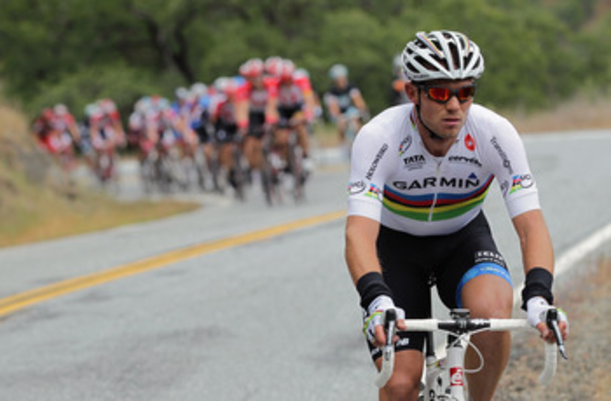SANTA CLARA COUNTY, CA - MAY 18:  Thor Hushovd of Norway riding Team Garmin-Cervelo is about to be absorbed by the peloton after falling out of the breakaway on the climb of Mt. Hamilton during stage four of the 2011 AMGEN Tour of California from Livermor