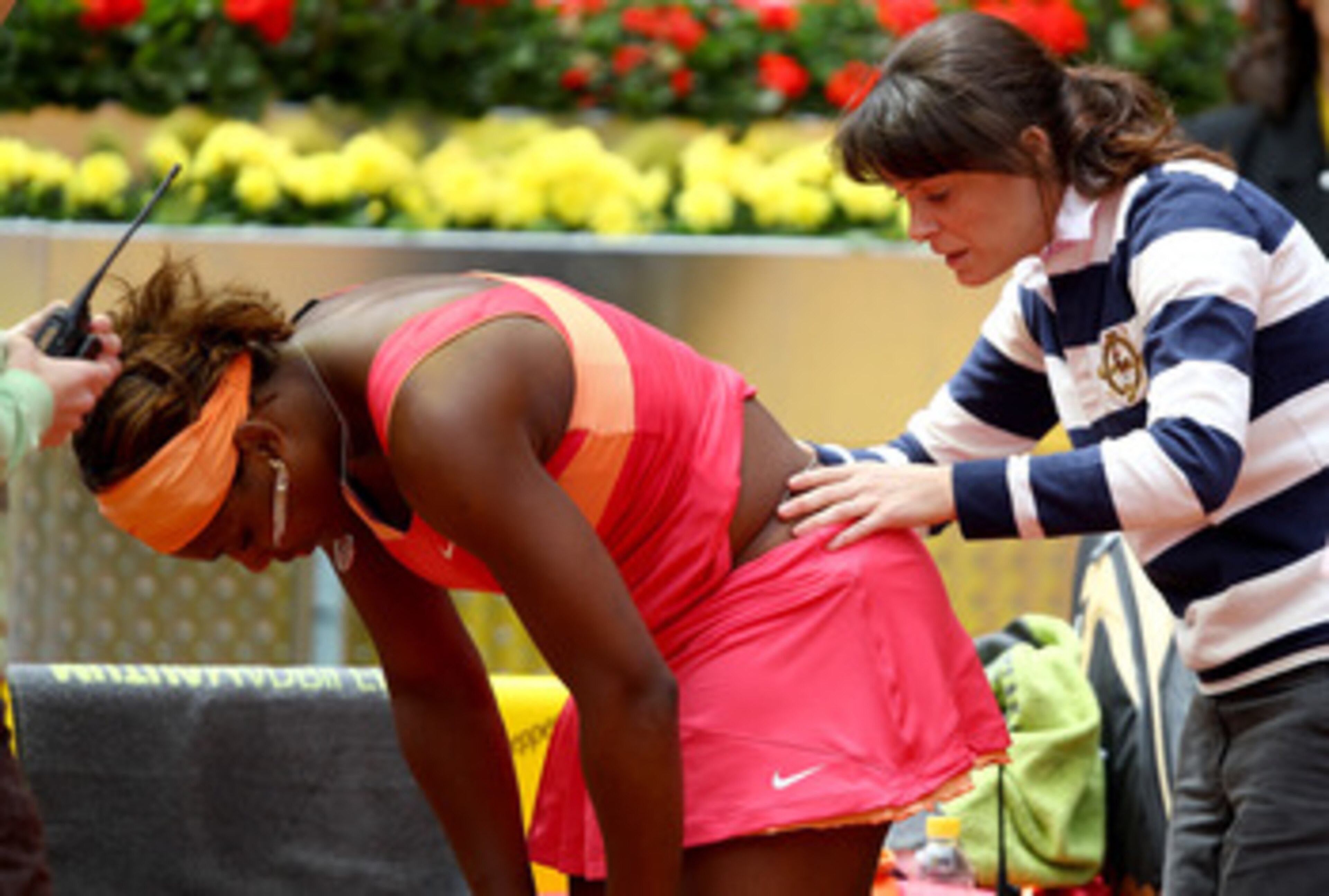 MADRID, SPAIN - MAY 10: Serena Williams of the USA receives treatment for an injury from the tour doctor against Vera Dushevina of Russia in their second round match during the Mutua Madrilena Madrid Open tennis tournament at the Caja Magica on May 10, 2 MADRID, SPAIN - MAY 10: Serena Williams of the USA receives treatment for an injury from the tour doctor against Vera Dushevina of Russia in their second round match during the Mutua Madrilena Madrid Open tennis tournament at the Caja Magica on May 10, 2