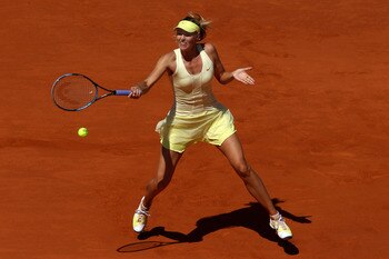 PARIS, FRANCE - JUNE 02:  Maria Sharapova of Russia hits a forehand during the women's singles semi final match between Na Li of China and Maria Sharapova of Russia on day twelve of the French Open at Roland Garros on June 2, 2011 in Paris, France.  (Phot