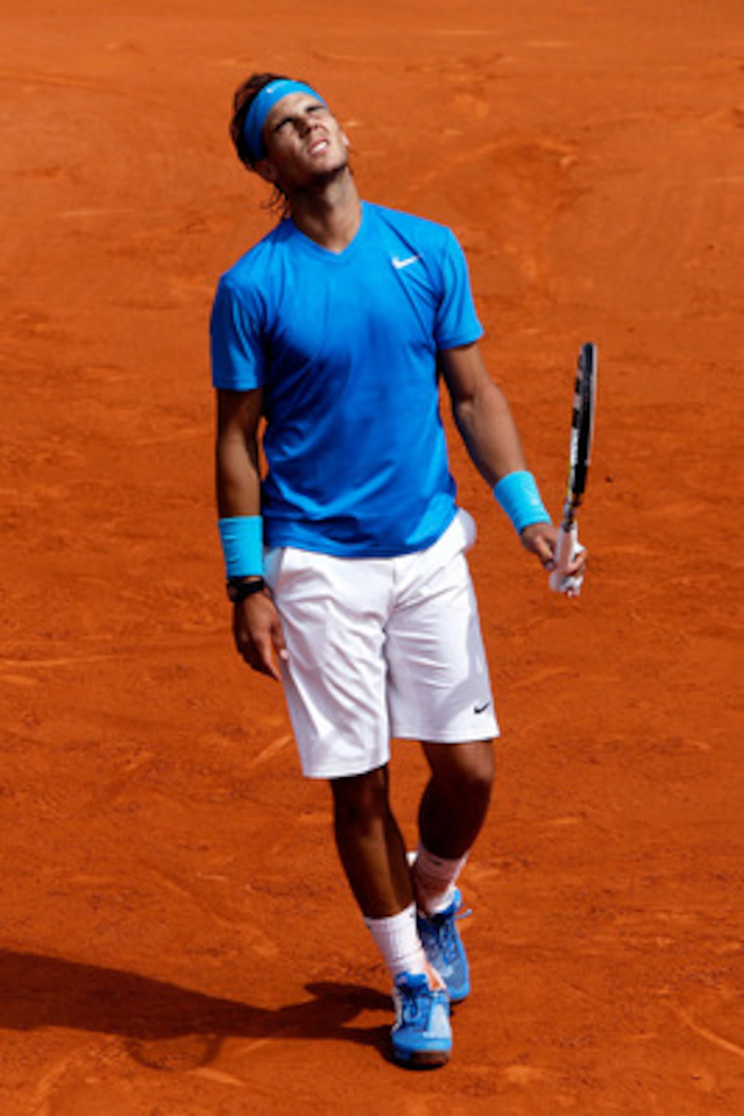 PARIS, FRANCE - MAY 24:  Rafael Nadal of Spain shows his dejection during the men's singles round one match between Rafael Nadal of Spain and John Isner of USA on day three of the French Open at Roland Garros on May 24, 2011 in Paris, France.  (Photo by M