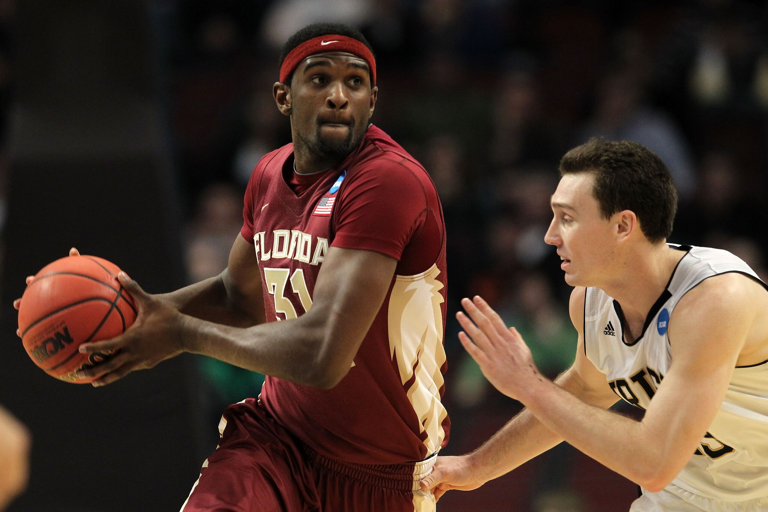 CHICAGO, IL - MARCH 20:  Chris Singleton #31 of the Florida State Seminoles drives against Ben Hansbrough #23 of the Notre Dame Fighting Irish in the second half during the third round of the 2011 NCAA men's basketball tournament at the United Center on M
