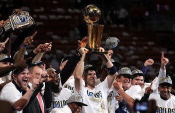 MIAMI, FL - JUNE 12:  Jason Kidd #2 of the Dallas Mavericks holds the Larry O'Brien trophy after the Mavericks won 105-95 against the Miami Heat in Game Six of the 2011 NBA Finals at American Airlines Arena on June 12, 2011 in Miami, Florida. NOTE TO USER