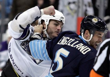 PITTSBURGH, PA - FEBRUARY 10:  Kevin Westgarth #19 of the Los Angeles Kings mixes it up with Deryk Engelland #5 of the Pittsburgh Penguins at Consol Energy Center on February 10, 2011 in Pittsburgh, Pennsylvania.  (Photo by Justin K. Aller/Getty Images)