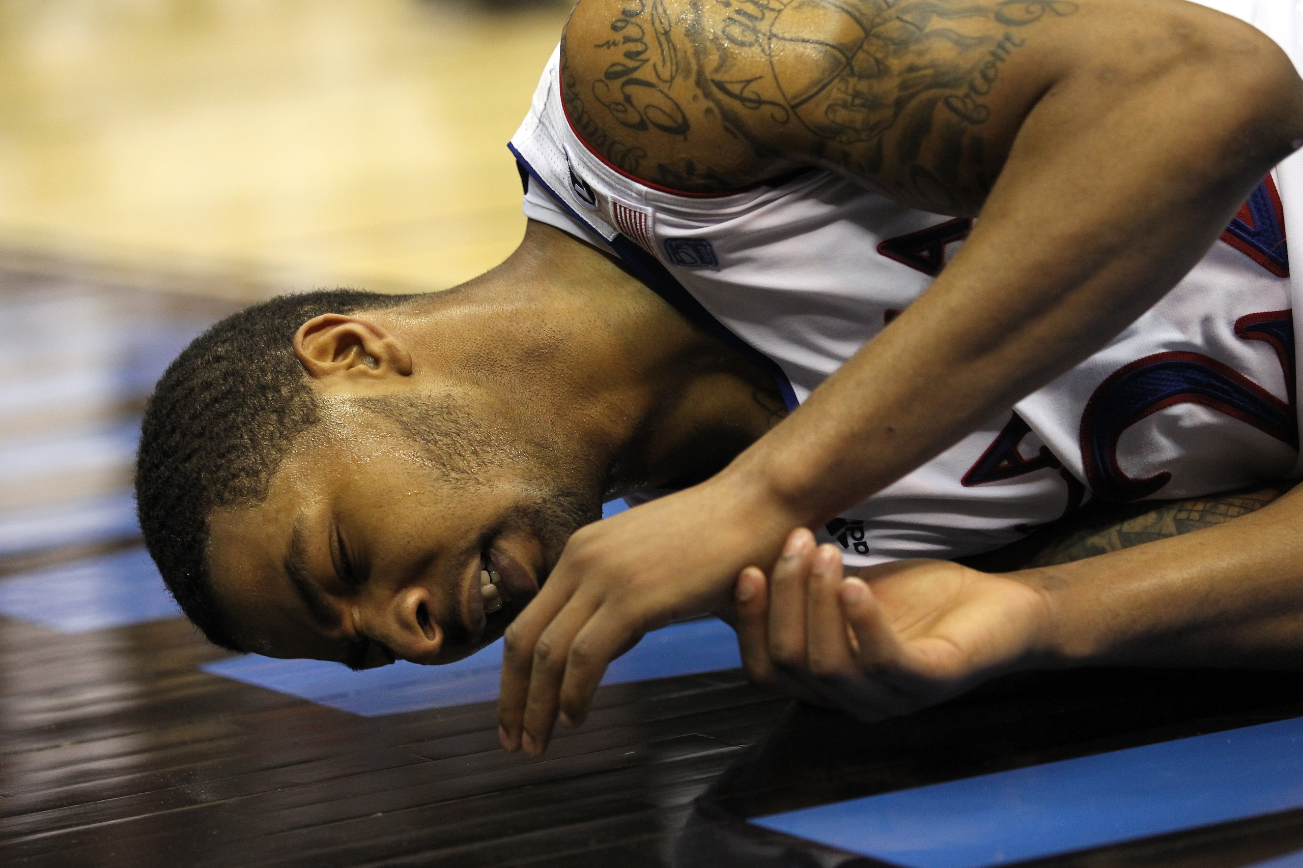 SAN ANTONIO, TX - MARCH 27:  Marcus Morris #22 of the Kansas Jayhawks reacts on the court during the southwest regional final of the 2011 NCAA men's basketball tournament against the Virginia Commonwealth Rams at the Alamodome on March 27, 2011 in San Ant