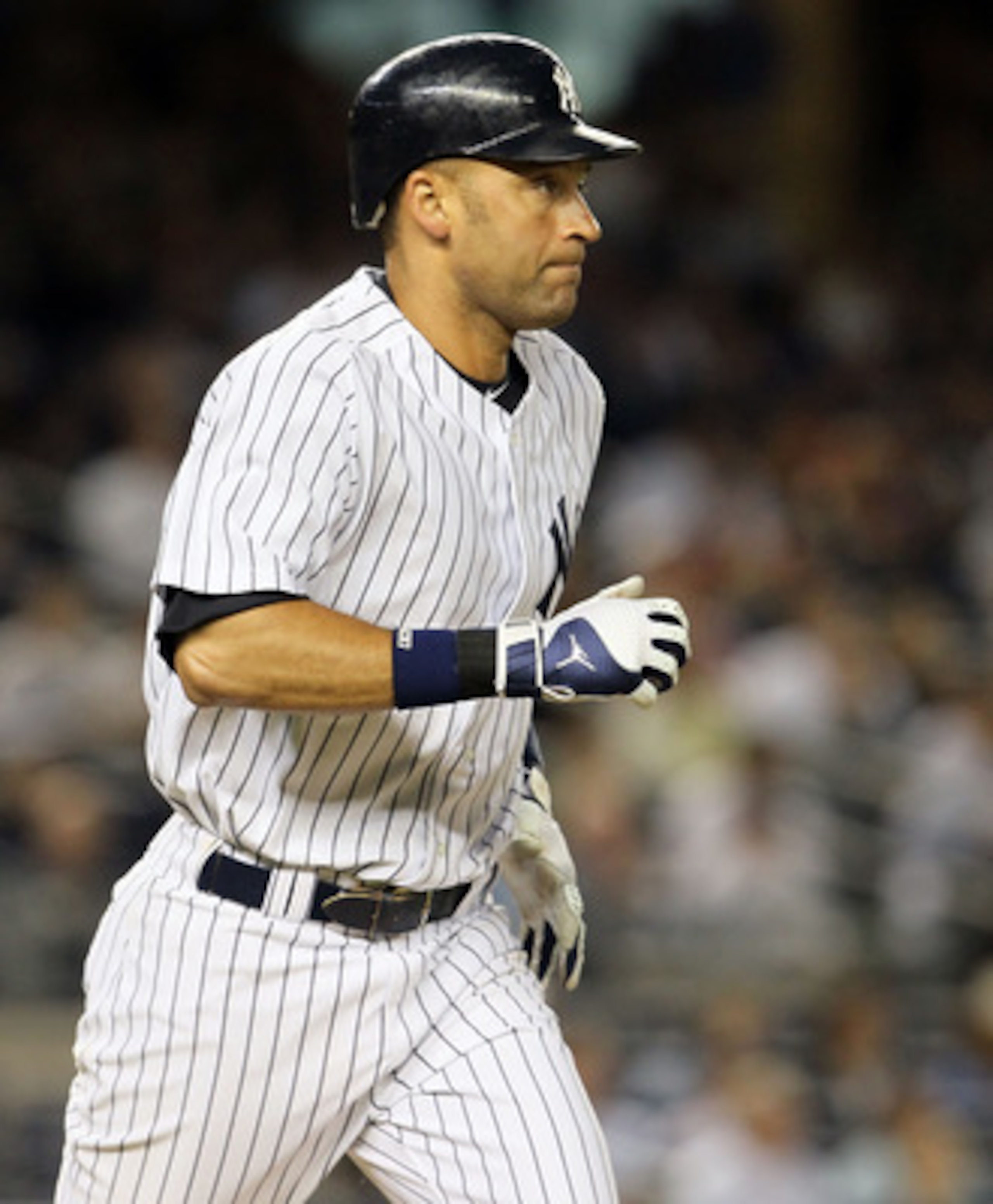 NEW YORK, NY - JUNE 13:  Derek Jeter #2 of the New York Yankees runs as he flies out in the fifth inning against the Cleveland Indians on June 13, 2011 at Yankee Stadium in the Bronx borough of New York City. Jeter suffered a sore right calf on the play a