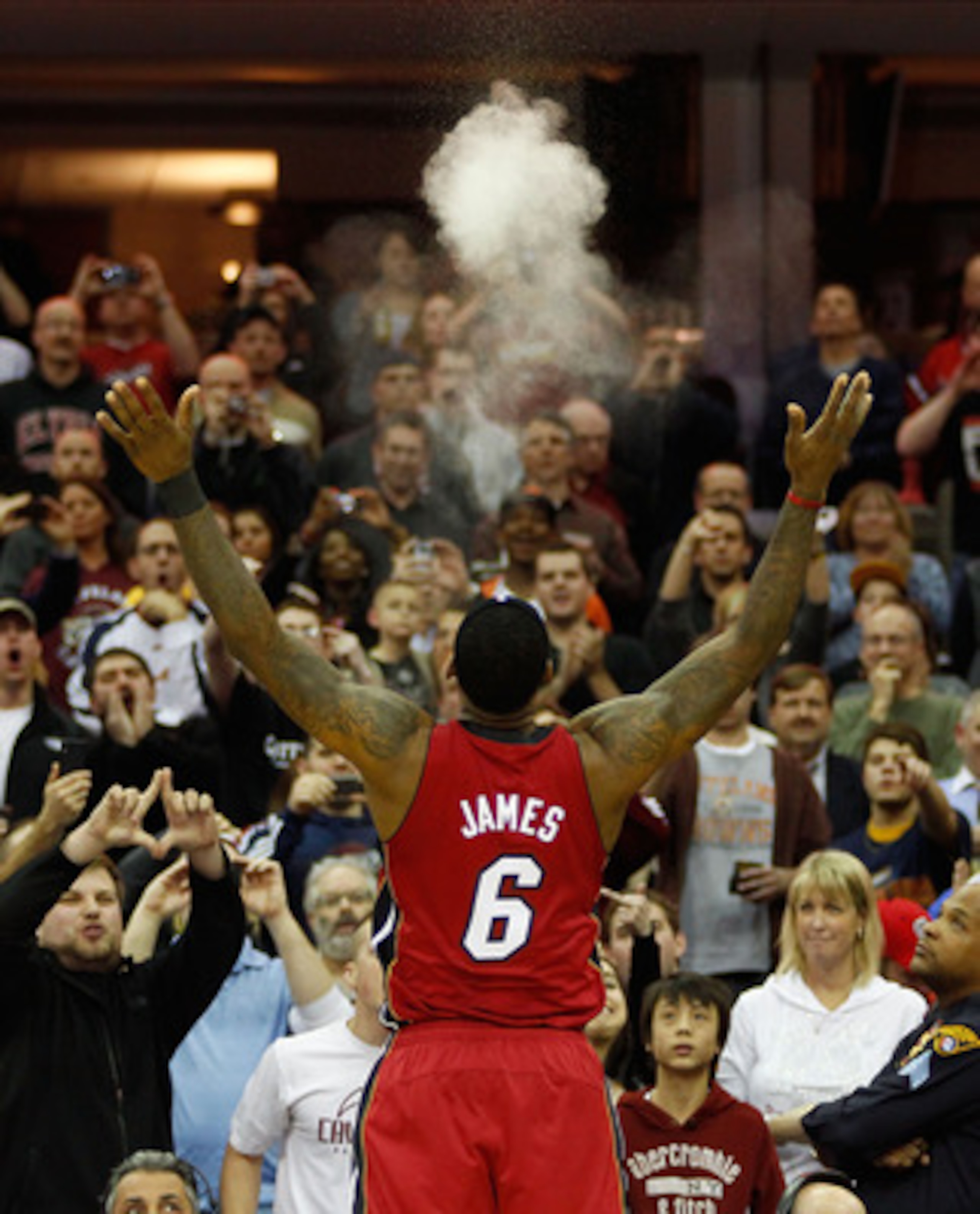 CLEVELAND - MARCH 29: LeBron James #6 of the Miami Heat performs his pre-game chalk throw ritual before the game against the Cleveland Cavaliers on March 29, 2011 at Quicken Loans Arena in Cleveland, Ohio. NOTE TO USER: User expressly acknowledges and agr