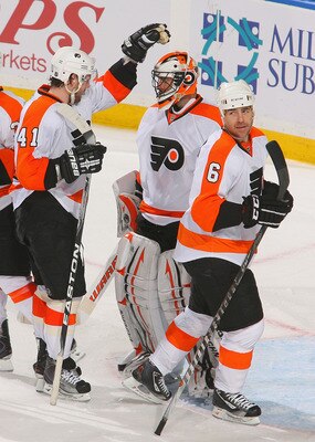 BUFFALO, NY - APRIL 18: Andrej Mezaros #41 and Sean O'Donnell #6 of the Philadelphia Flyers congratulate Brian Boucher  #33 after defeating the Buffalo Sabres  4-2 in Game Three of the Eastern Conference Quarterfinals during the 2011 NHL Stanley Cup Playo