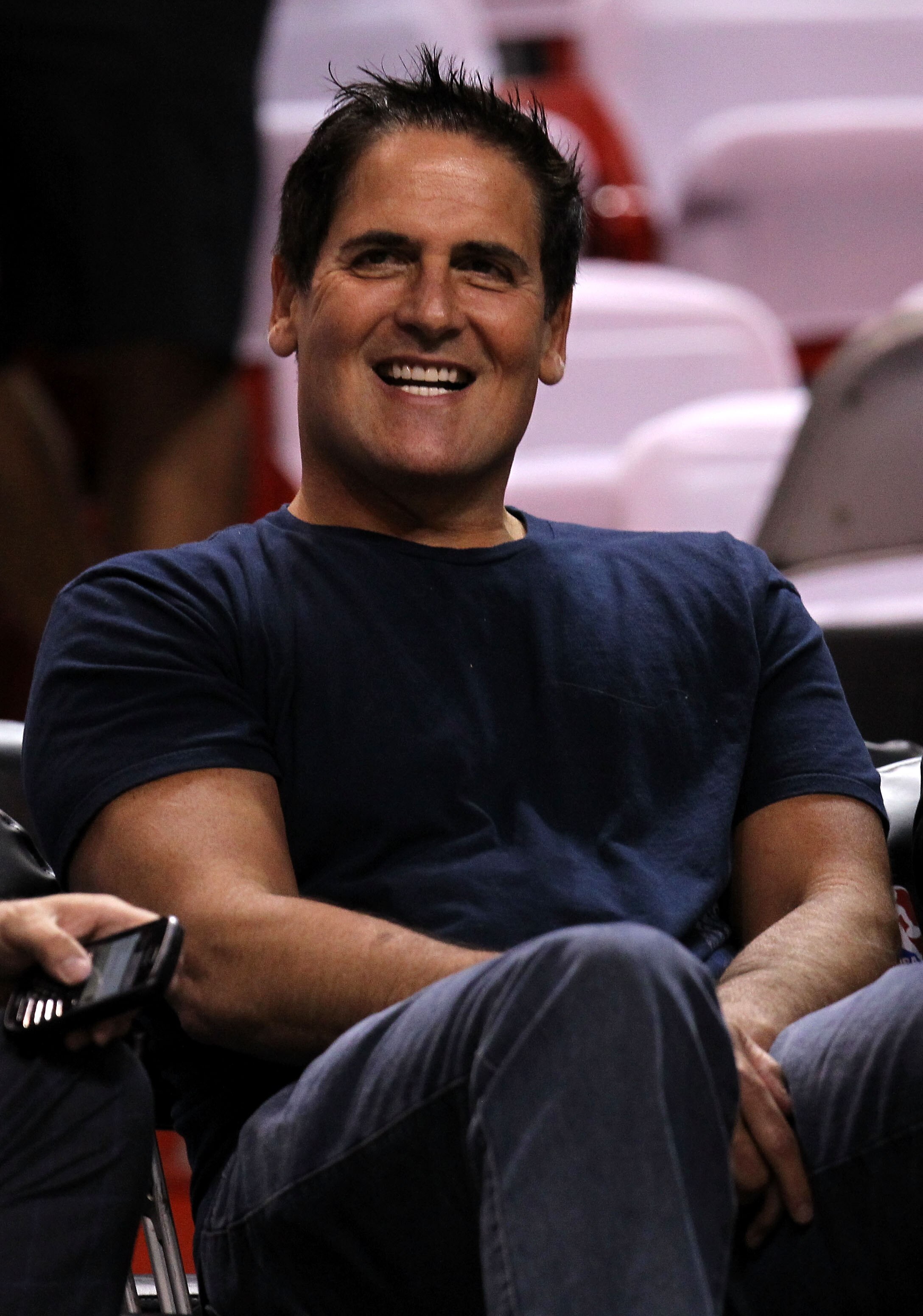 MIAMI, FL - JUNE 12:  Owner Mark Cuban of the Dallas Mavericks smiles as he sits courtside before Game Six of the 2011 NBA Finals against the Miami Heat at American Airlines Arena on June 12, 2011 in Miami, Florida. NOTE TO USER: User expressly acknowledg