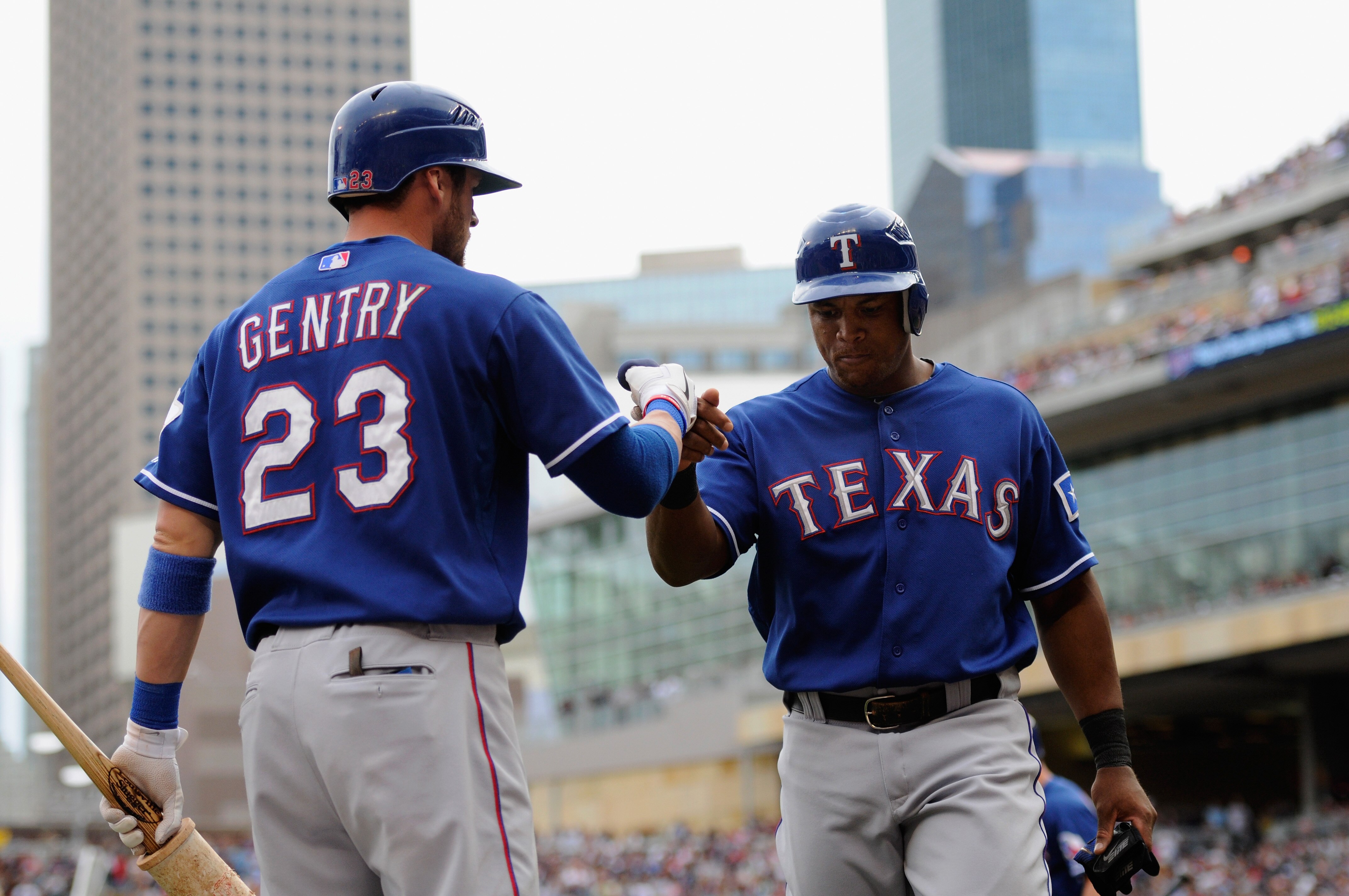 MINNEAPOLIS, MN - JUNE 12: Craig Gentry #23 and Adrian Beltre #29 of the Texas Rangers celebrate Beltre scoring against the Minnesota Twins during the eighth inning of their game on June 12, 2011 at Target Field in Minneapolis, Minnesota. Twins defeated t