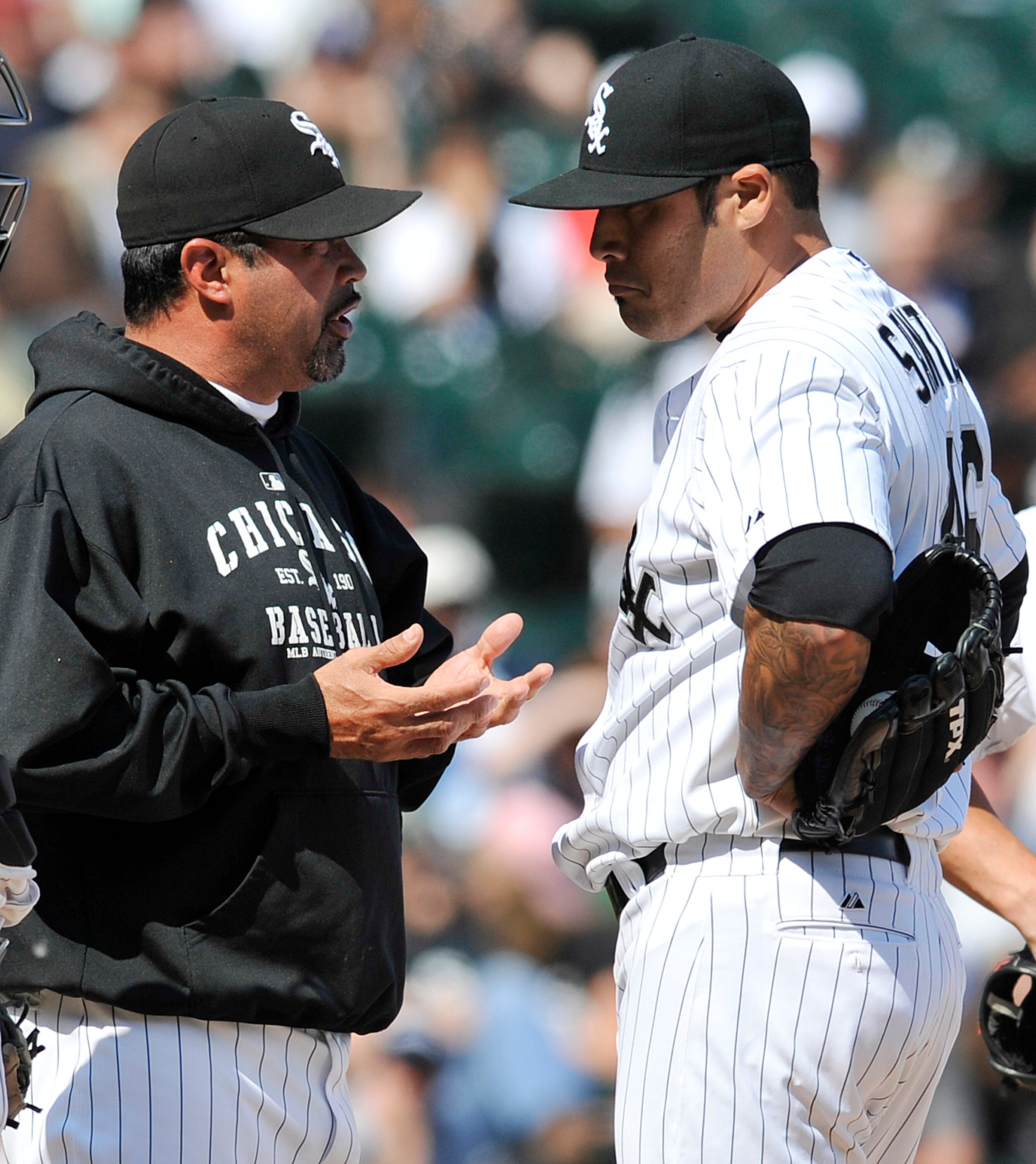 CHICAGO, IL - JUNE 12: Sergio Santos #46 of the Chicago White Sox talks with his manager Ozzie Guillen during the ninth inning against the Oakland Athletics on June 12, 2011 at U.S. Cellular Field in Chicago, Illinois. The White Sox defeated the Athletics