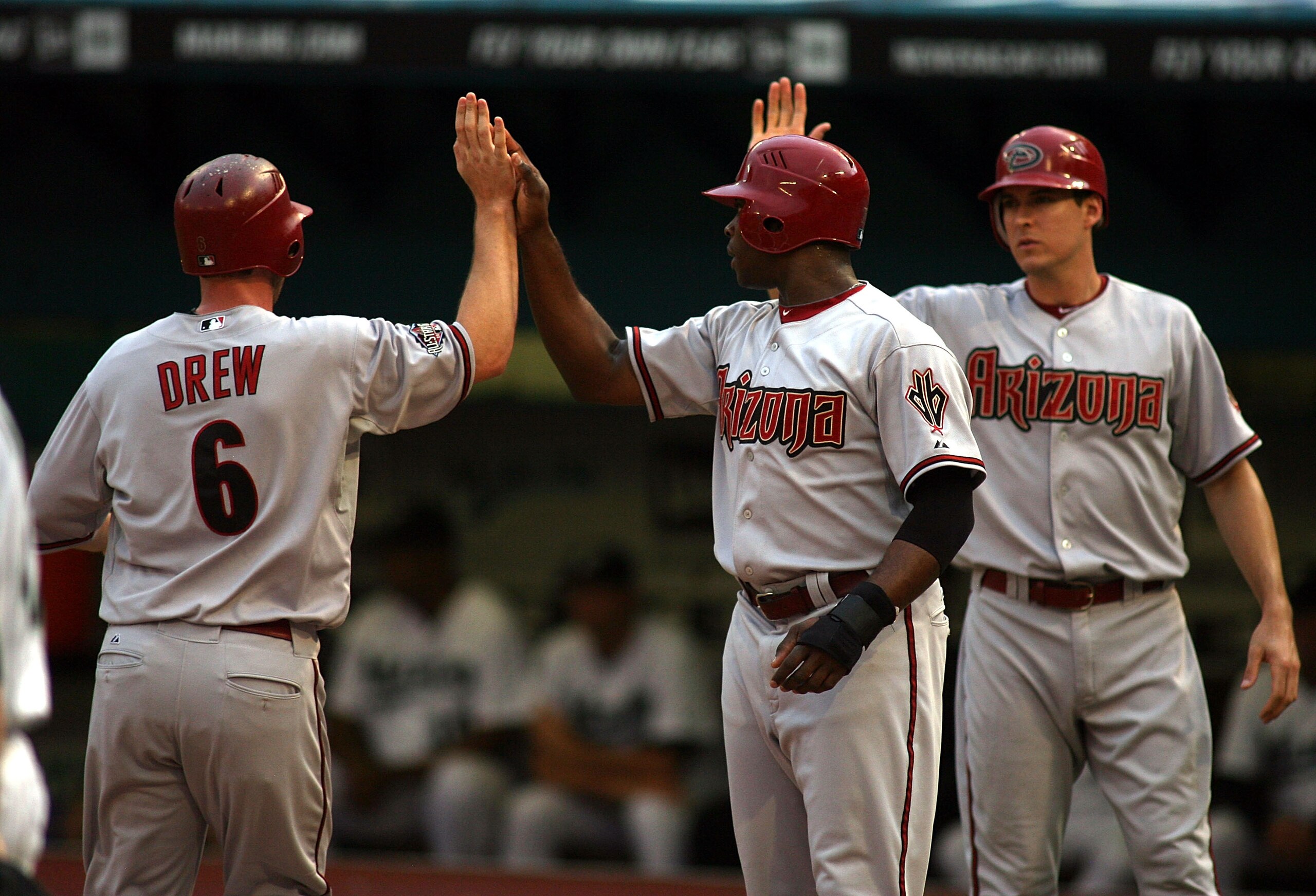 MIAMI GARDENS, FL - JUNE 13: (L-R) Stephen drew #6, Justin Upton #10 and Kelly Johnson #2 of the Arizona Diamondbacks celebrate scoring against the Florida Marlins at Sun Life Stadium on June 13, 2011 in Miami Gardens, Florida.  (Photo by Marc Serota/Gett