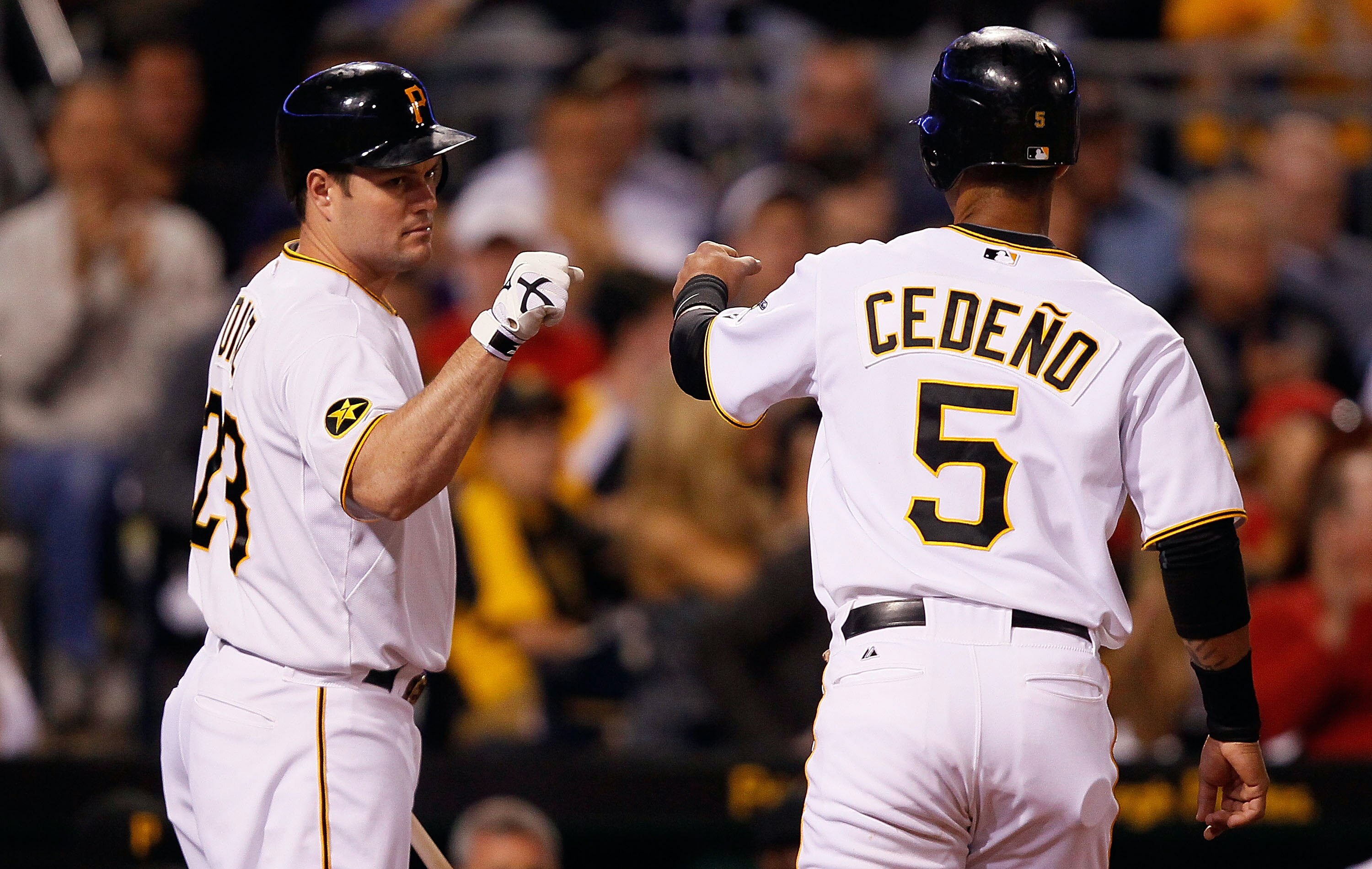 PITTSBURGH - JUNE 13:  Ronny Cedeno #5 of the Pittsburgh Pirates is congratulated by teammate Matt Diaz #23 after walking in a run against the New York Mets in the 8th inning during the game on June 13, 2011 at PNC Park in Pittsburgh, Pennsylvania.  (Phot