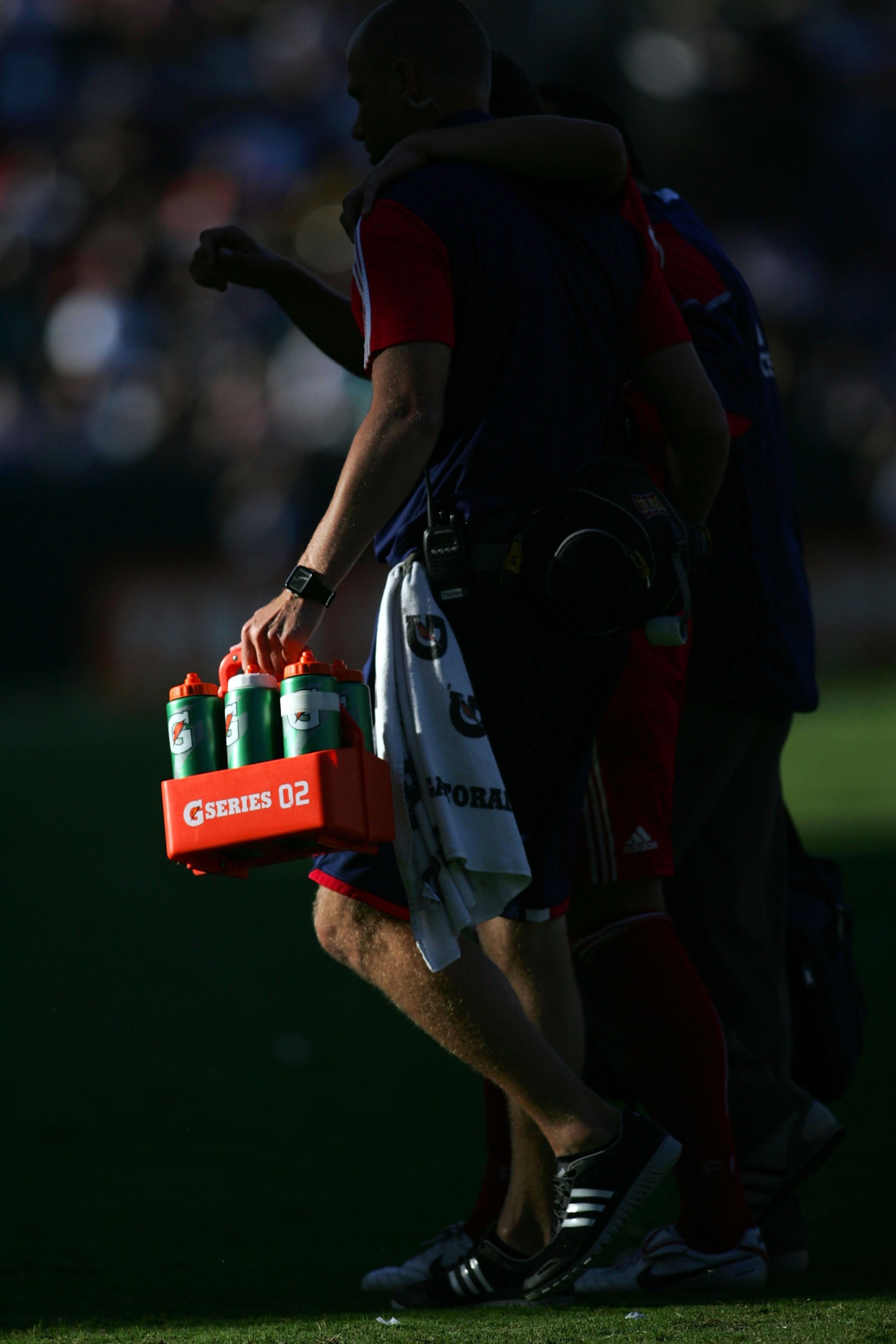 CARSON, CA - AUGUST 01: A Chicago Fire player is helped off the pitch by a water boy during a break in MLS match action against the Los Angeles Galaxy at The Home Depot Center on August 1, 2010 in Carson, California. The Fire defeated the Galaxy 3-2. (P CARSON, CA - AUGUST 01: A Chicago Fire player is helped off the pitch by a water boy during a break in MLS match action against the Los Angeles Galaxy at The Home Depot Center on August 1, 2010 in Carson, California. The Fire defeated the Galaxy 3-2. (P