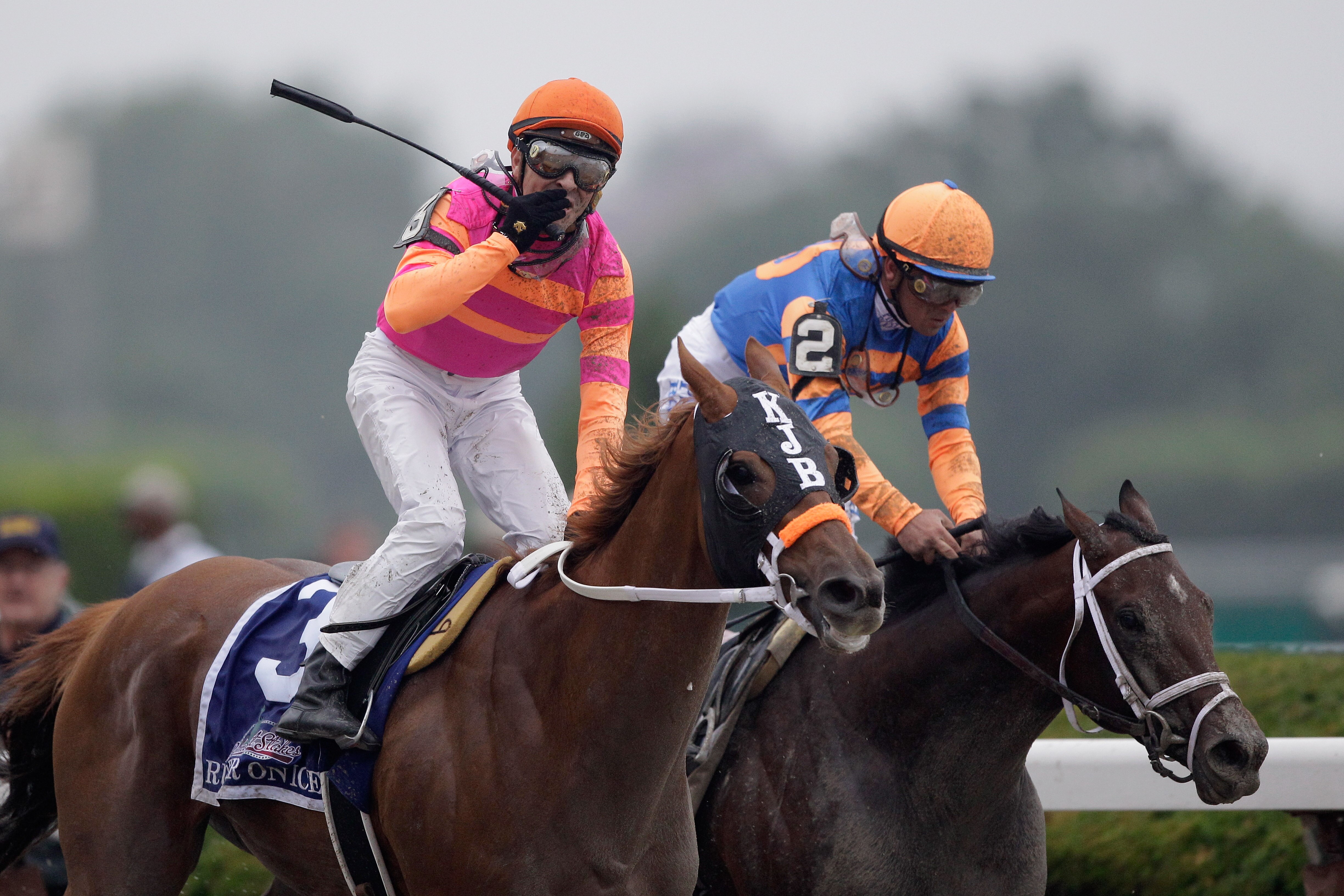 ELMONT, NY - JUNE 11:  Jockey Jose Valdivia, Jr. celebrates aboard Ruler on Ice #3 in front of Javier Castellano riding Stay Thirsty #2 after winning the 143rd running of the Belmont Stakes at Belmont Park on June 11, 2011 in Elmont, New York.  (Photo by