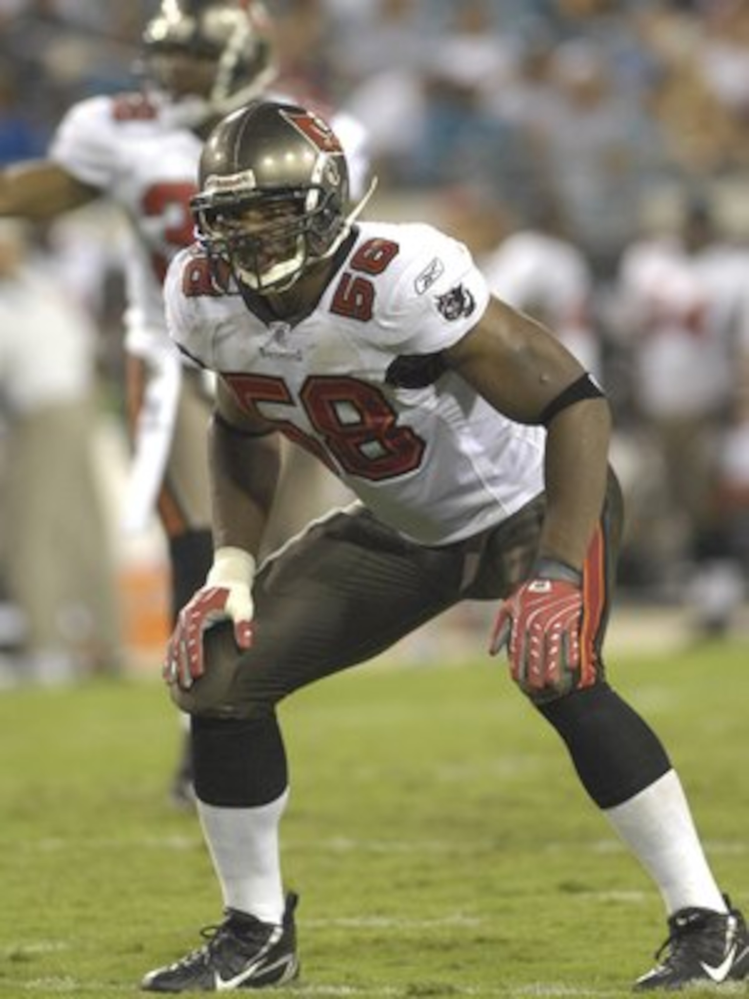 JACKSONVILLE, FL - AUGUST 18: Linebacker Quincy Black #58 of the Tampa Bay Buccaneers sets on defense against the Jacksonville Jaguars at Jacksonville  Municipal Stadium on August 18, 2007 in Jacksonville, Florida. (Photo by Al Messerschmidt/Getty Images)