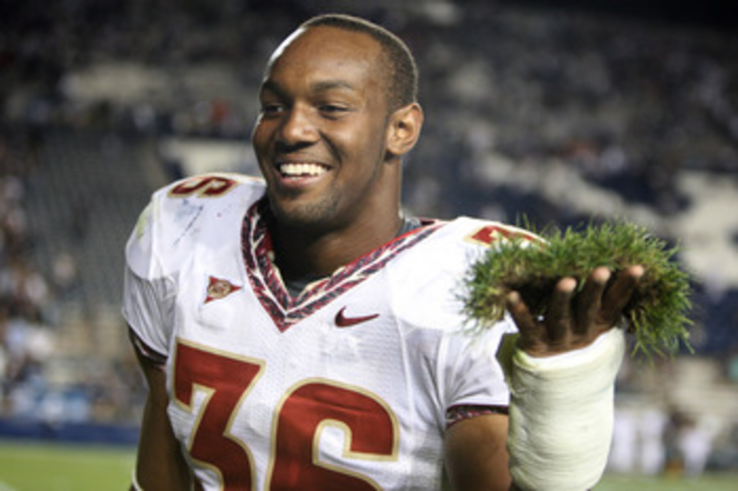 PROVO, UT. - SEPTEMBER 19:  Dekoda Watson #36 of the Florida State Seminoles holds a piece of sod from the field to add to the sod cemetery after a win over the Brigham Young Cougars at La Vell Edwards Stadium on September 19, 2009 in Provo, Utah.  (Photo