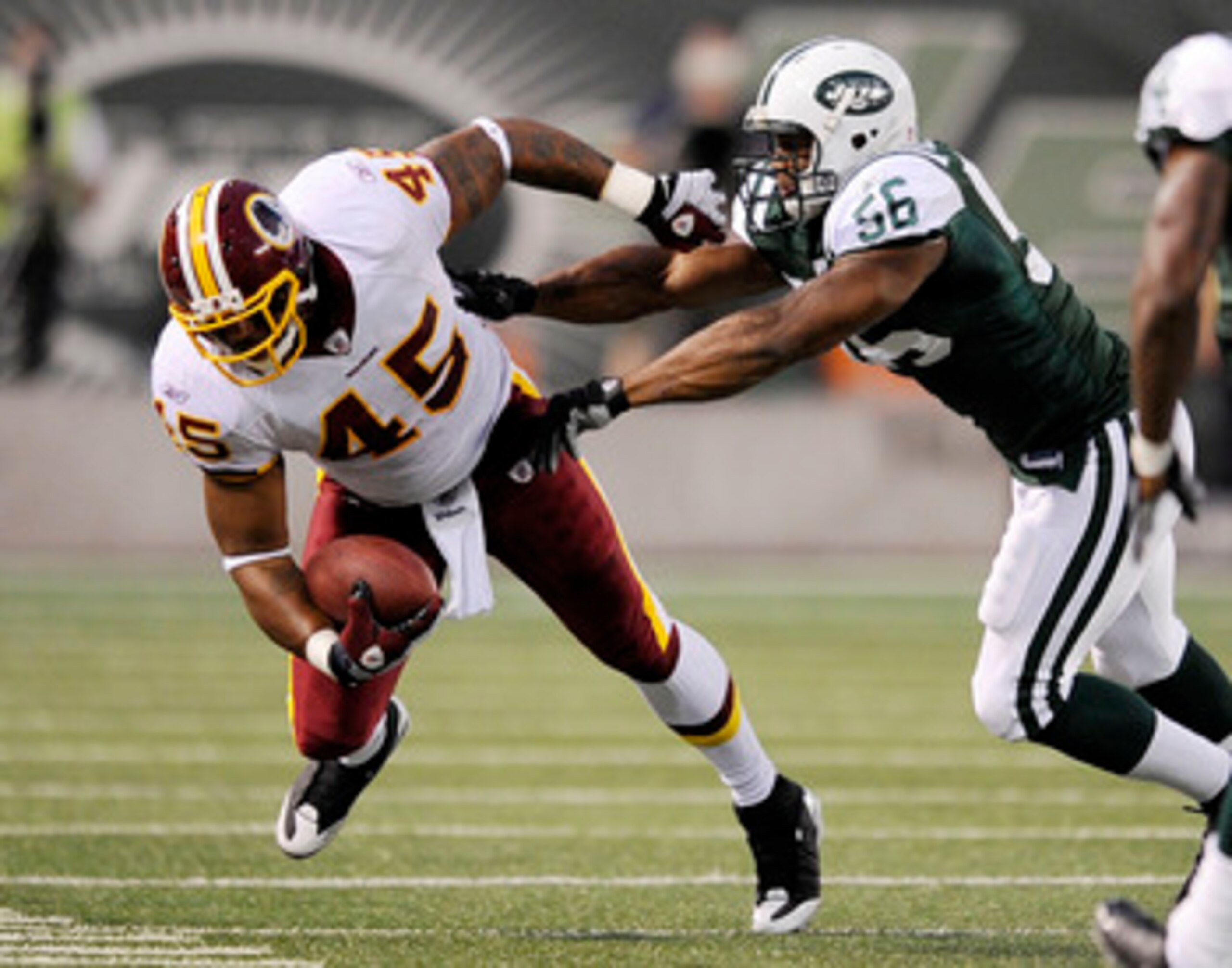 EAST RUTHERFORD, NJ - AUGUST 16: Vernon Gholston #56 of the New York Jets takes down Mike Sellers #45 of the Washington Redskins in a pre-season NFL game at Giants Stadium, August 16, 2008 in East Rutherford, New Jersey. (Photo by Jeff Zelevansky/Getty EAST RUTHERFORD, NJ - AUGUST 16: Vernon Gholston #56 of the New York Jets takes down Mike Sellers #45 of the Washington Redskins in a pre-season NFL game at Giants Stadium, August 16, 2008 in East Rutherford, New Jersey. (Photo by Jeff Zelevansky/Getty