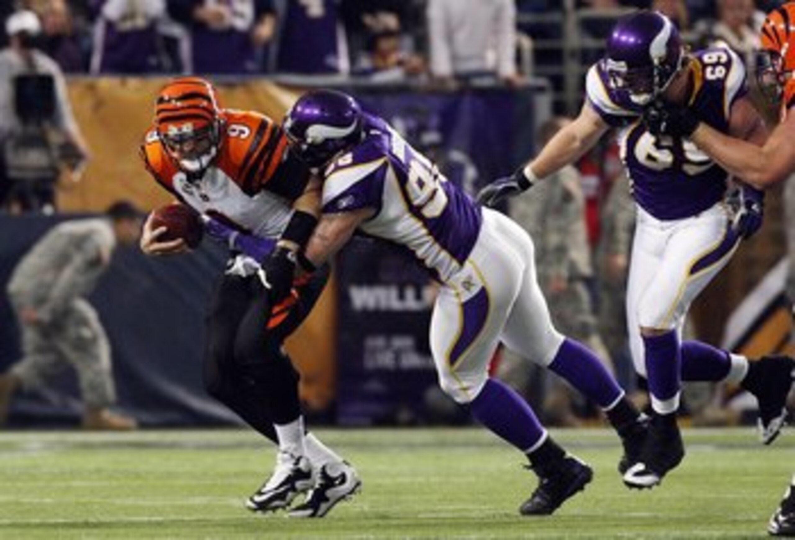 MINNEAPOLIS, MN - DECEMBER 13: Carson Palmer #9 of the Cincinnati Bengals is sacked by Brian Robison #96 of the Minnesota Vikings on December 13, 2009 at Hubert H. Humphrey Metrodome in Minneapolis, Minnesota. (Photo by Elsa/Getty Images) (Photo by Jim MINNEAPOLIS, MN - DECEMBER 13: Carson Palmer #9 of the Cincinnati Bengals is sacked by Brian Robison #96 of the Minnesota Vikings on December 13, 2009 at Hubert H. Humphrey Metrodome in Minneapolis, Minnesota. (Photo by Elsa/Getty Images) (Photo by Jim