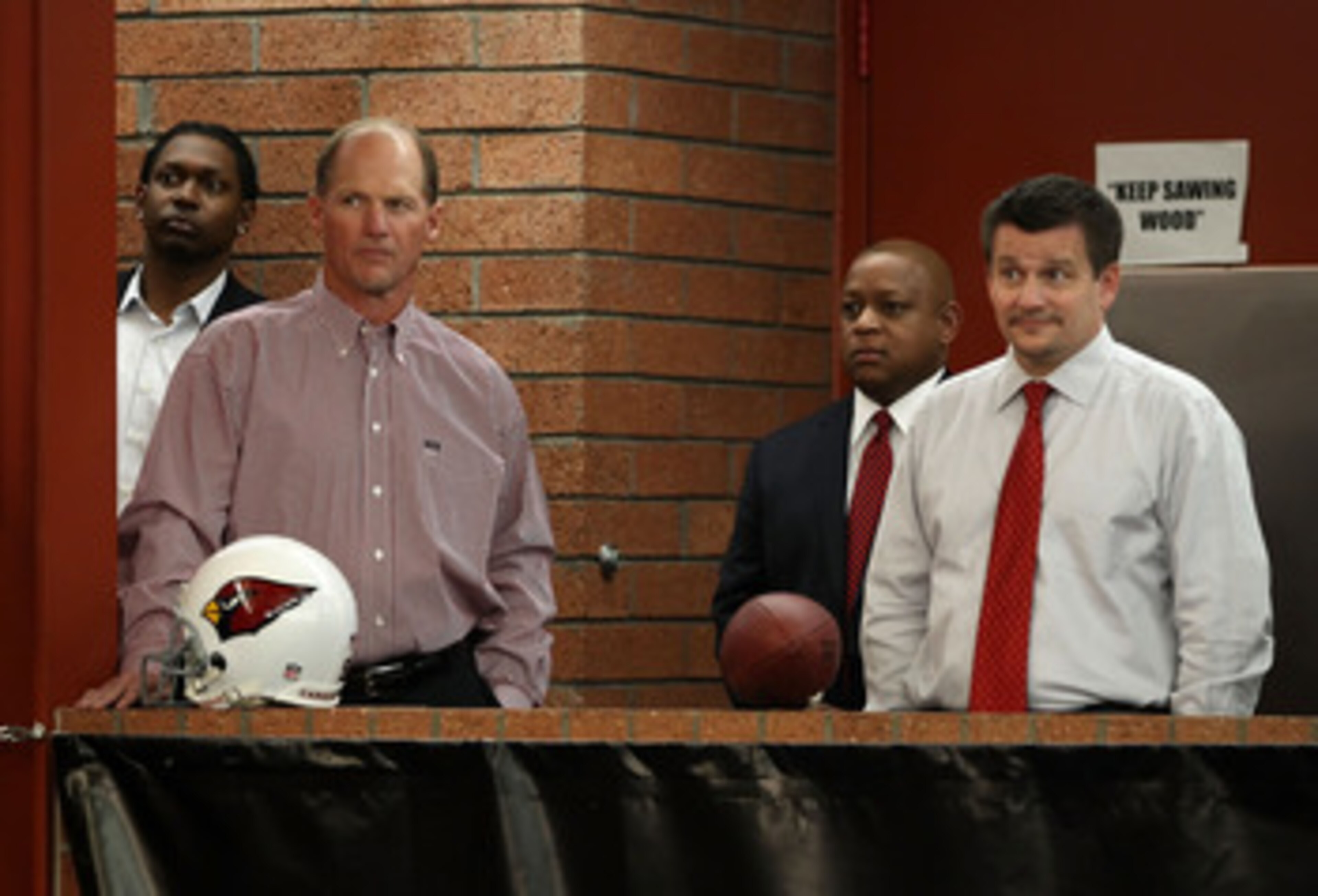 TEMPE, AZ - APRIL 29:  (2L-R) Head coach Ken Whisenhunt, general manager Rod Graves and President Michael Bidwill of the Arizona Cardinals listen to first round draft pick Patrick Peterson (not pictured) speak during a press conference to introduce him at