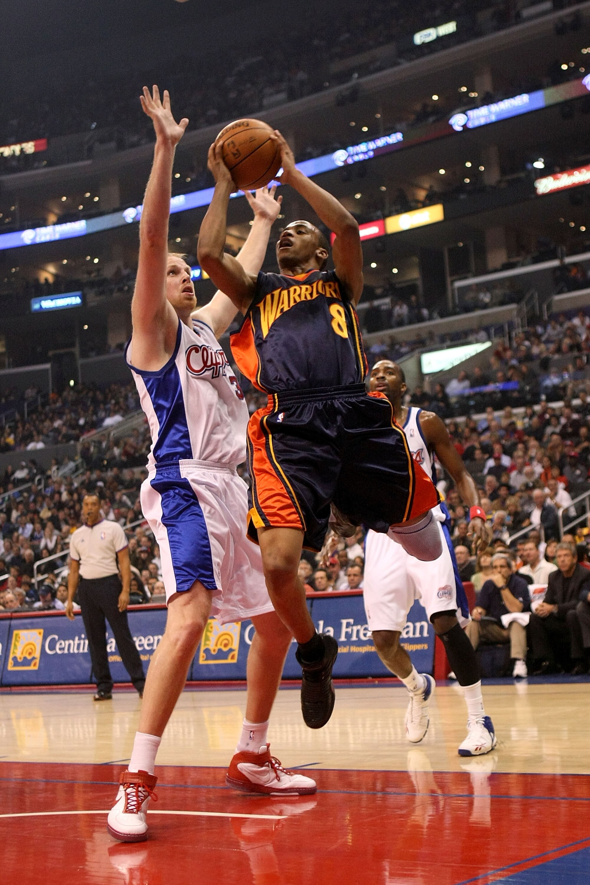 LOS ANGELES, CA - NOVEMBER 02:  Monta Ellis #8 of the Golden State Warriors goes up for a shot over Chris Kaman #35 of the Los Angeles Clippers during a game on November 2, 2007 at Staples Center in Los Angeles, California.  NOTE TO USER: User expressly a