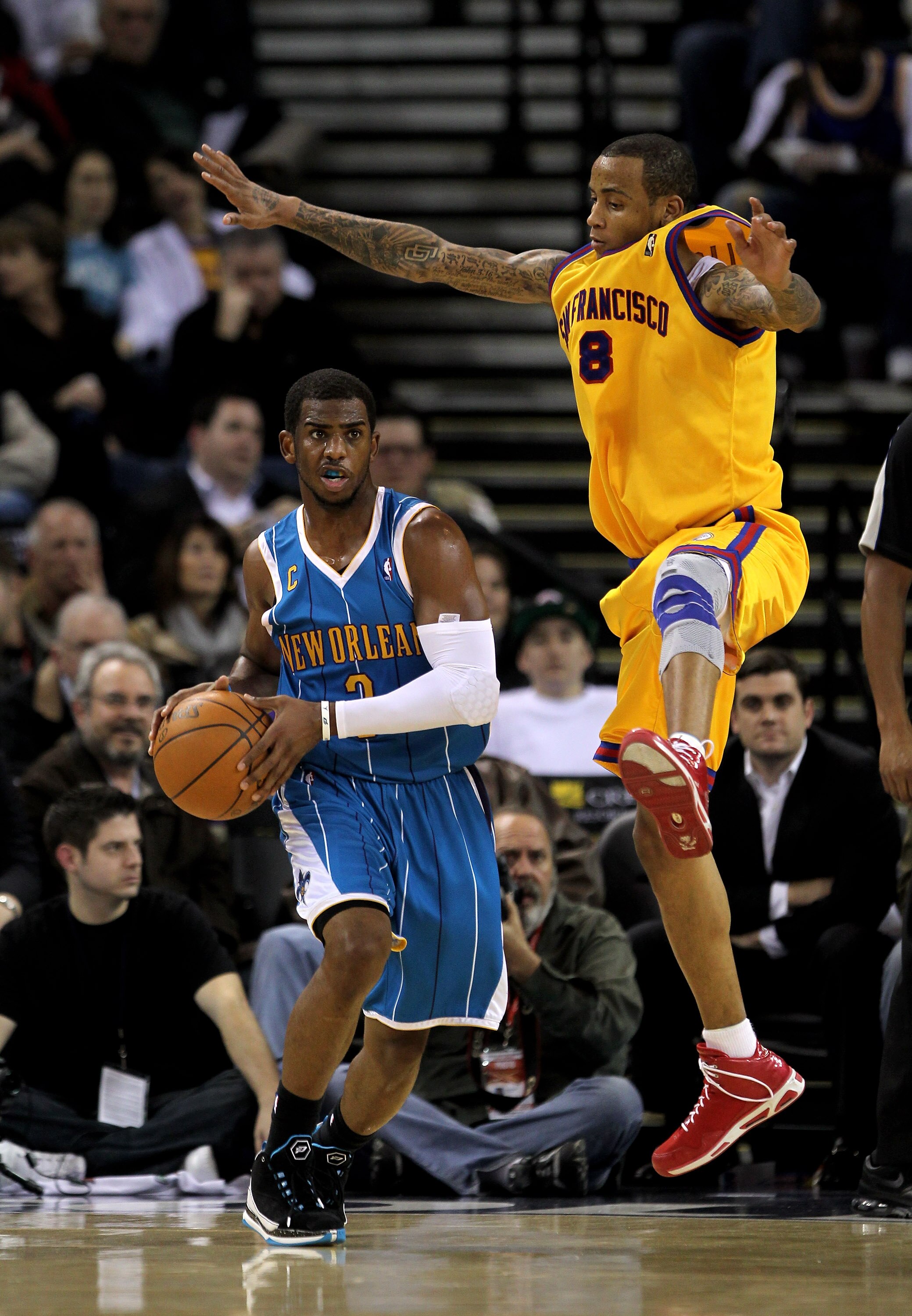 OAKLAND, CA - JANUARY 27:  Chris Paul #3 of the New Orleans Hornets is guarded by Monta Ellis #8 of the Golden State Warriors at Oracle Arena on January 27, 2010 in Oakland, California.  NOTE TO USER: User expressly acknowledges and agrees that, by downlo