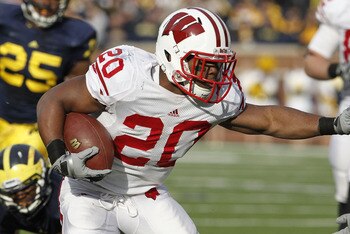 ANN ARBOR, MI - NOVEMBER 20:  James White #20 of the Wisconsin Badgers looks for running room while playing the Michigan Wolverines at Michigan Stadium on November 20, 2010 in Ann Arbor, Michigan. Wisconson won the game 48-28.  (Photo by Gregory Shamus/Ge
