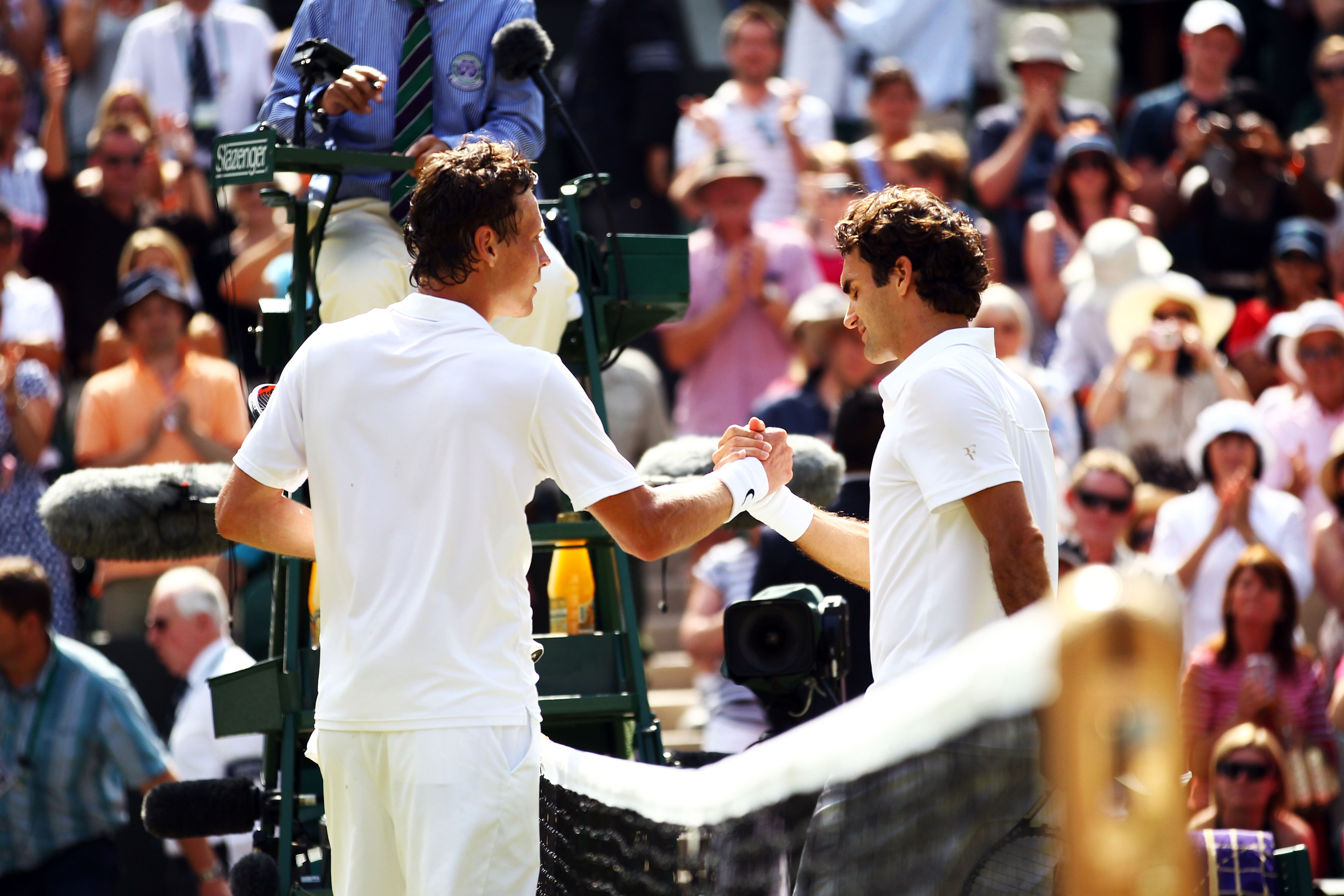 LONDON, ENGLAND - JUNE 30:  Tomas Berdych of Czech Republic (L) shakes hands after winning his Quarter Final match against Roger Federer of Switzerland on Day Nine of the Wimbledon Lawn Tennis Championships at the All England Lawn Tennis and Croquet Club