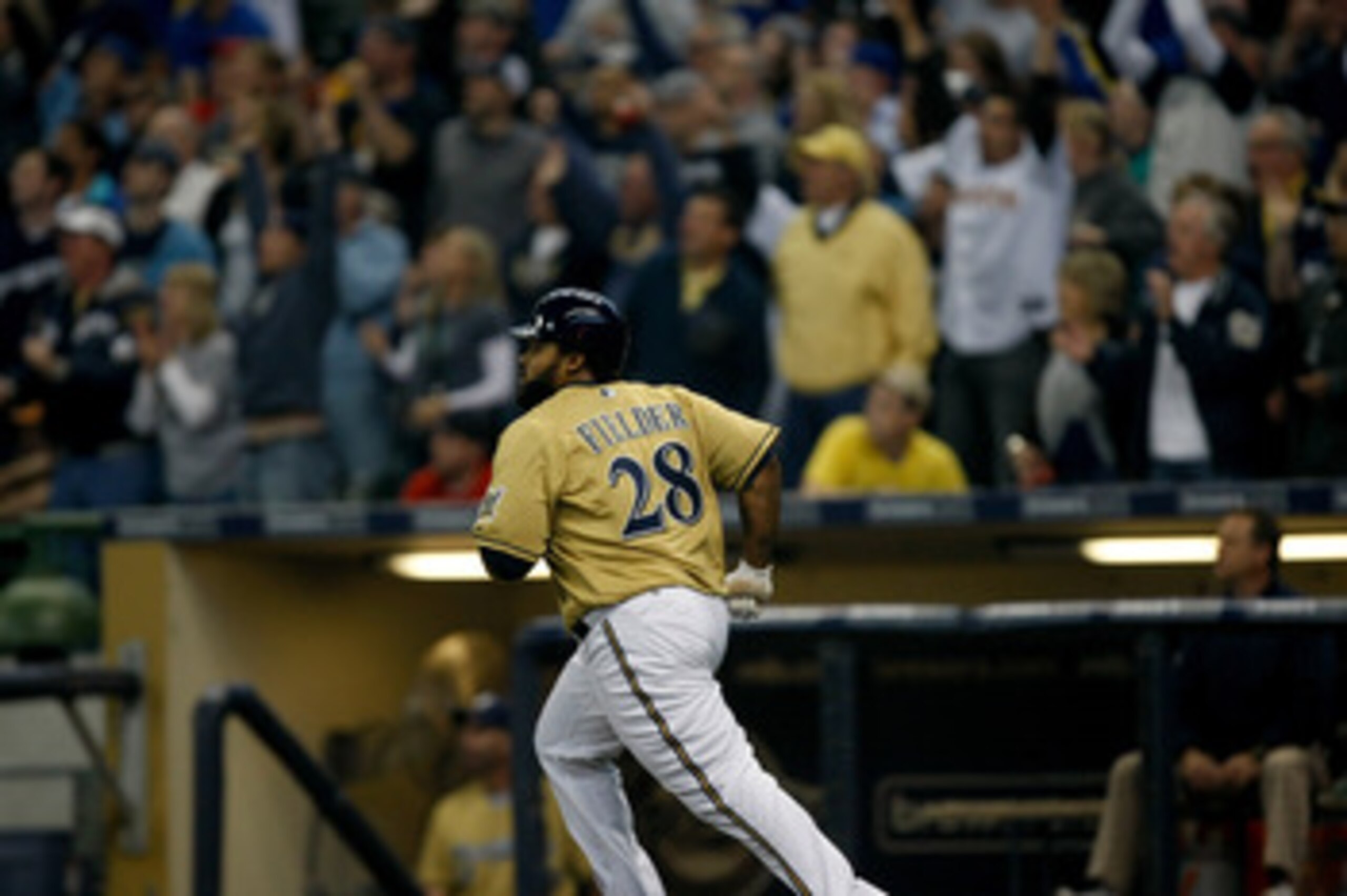 MILWAUKEE, WI - JUNE 11: Prince Fielder #28 of the Milwaukee Brewers runs after hitting a home run as fans cheer against the St. Louis Cardinals at the Miller Park on June 11, 2011 in Milwaukee, Wisconsin. (Photo by Scott Boehm/Getty Images)