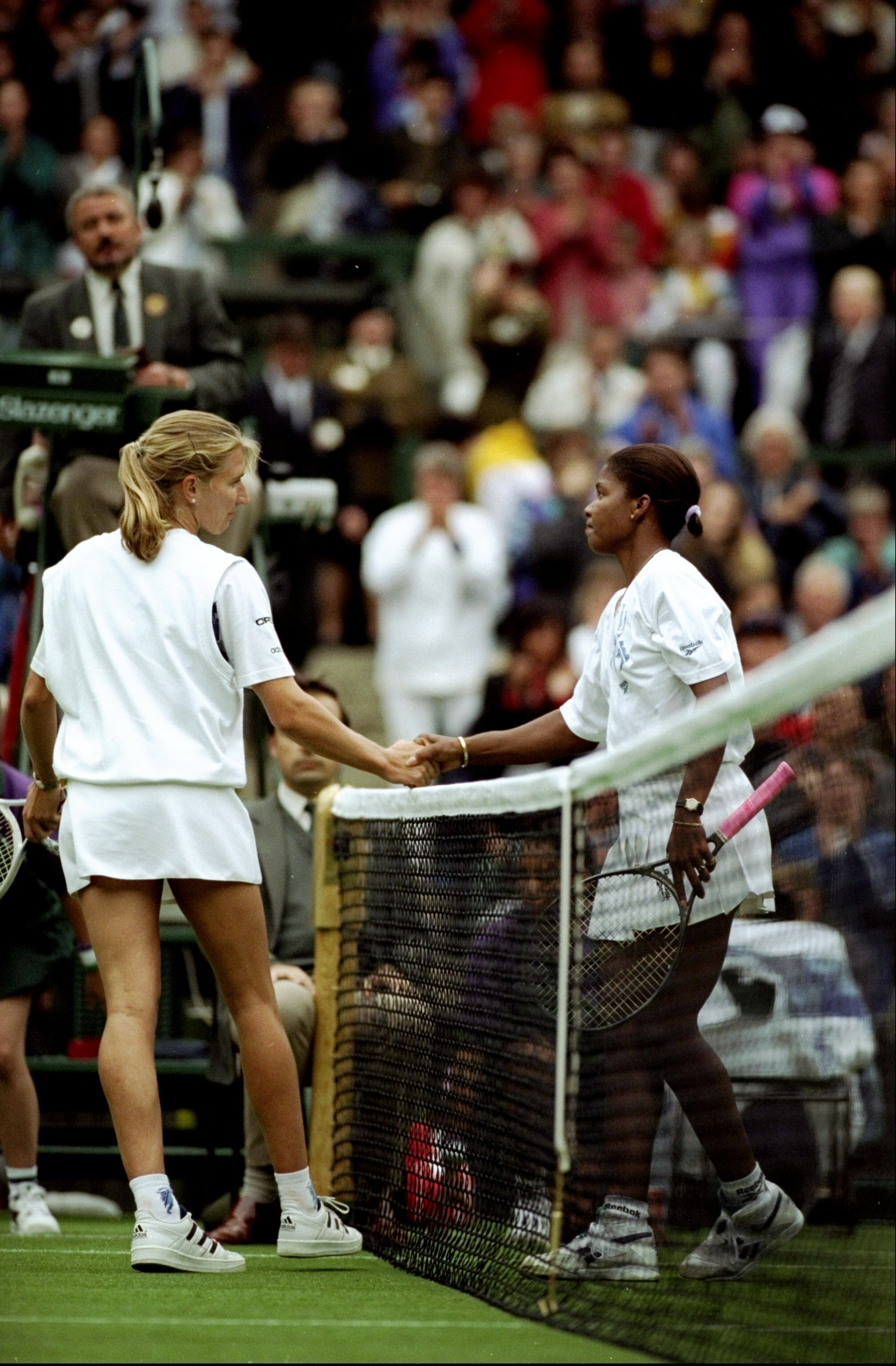 Jun-Jul 1994:  Steffi Graf of Germany shakes hands with Lori McNeil of the USA after their match during the Wimbledon Championships held at the All England Club in Wimbledon, England.  Lori McNeil won the match. \ Mandatory Credit: Bob  Martin/Allsport