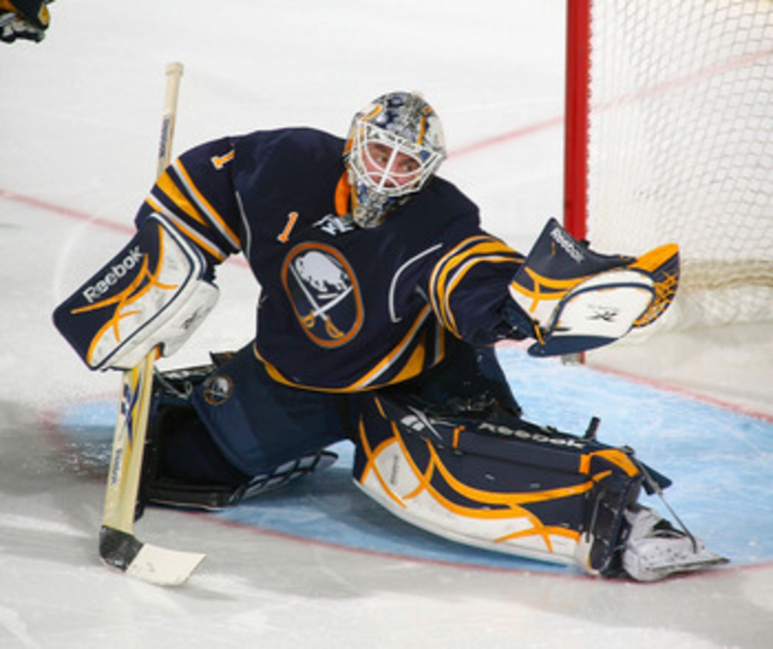 BUFFALO, NY - MARCH 30:  Jhonas Enroth #1 of the Buffalo Sabres makes a glove save against the New York Rangers at HSBC Arena on March 30, 2011 in Buffalo, New York.  (Photo by Rick Stewart/Getty Images)