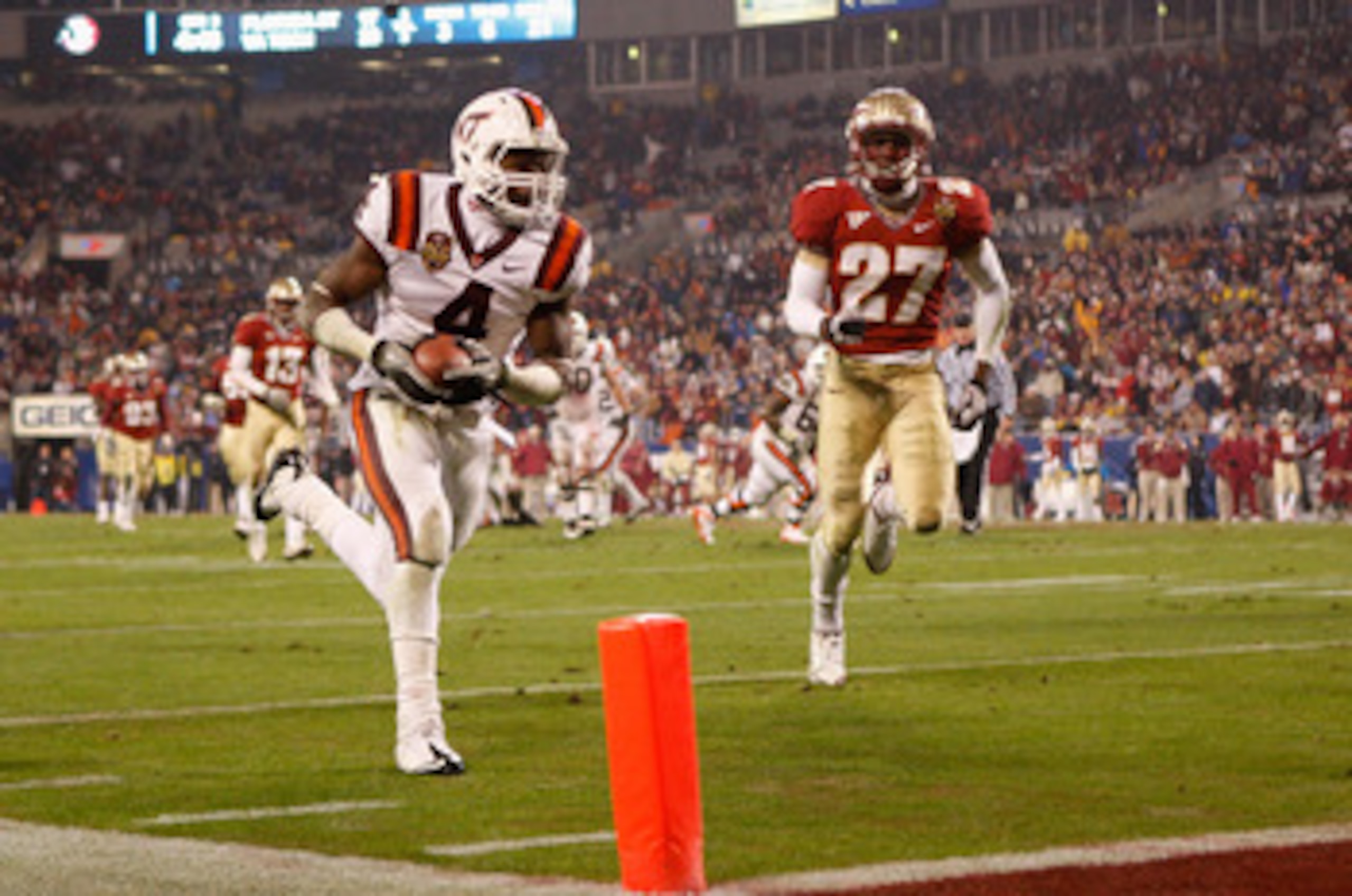 CHARLOTTE, NC - DECEMBER 04:  David Wilson #4 of the Virginia Tech Hokies runs for a touchdown during their game against the Florida State Seminoles at Bank of America Stadium on December 4, 2010 in Charlotte, North Carolina.  (Photo by Streeter Lecka/Get