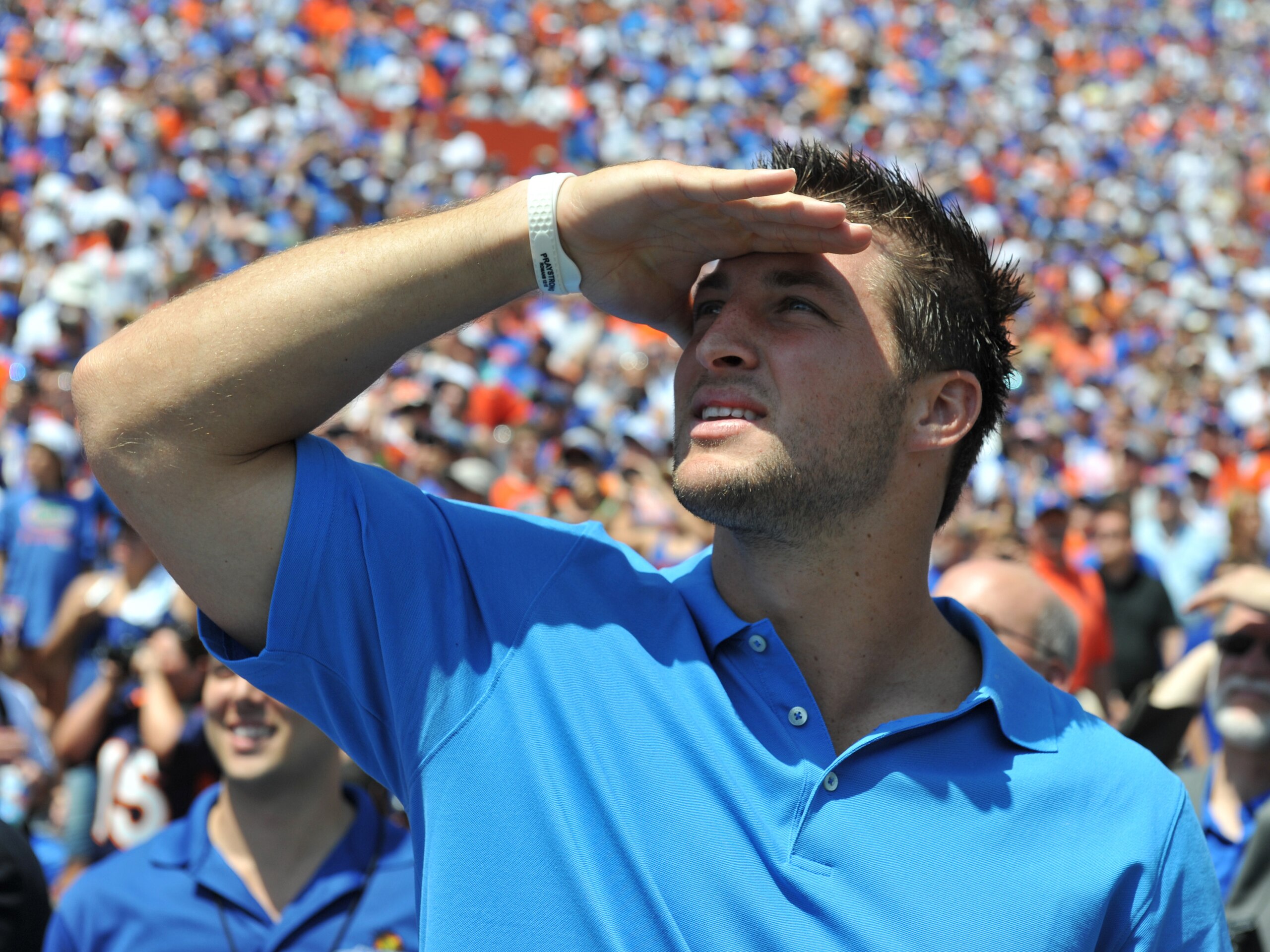 GAINESVILLE, FL - APRIL 9:  Tim Tebow watches a scoreboard as life-size statues of the Florida Gators three Heisman trophy winners are unvelied at halftime of the Orange and Blue spring football game April 9, 2011 Ben Hill Griffin Stadium at Gainesville,