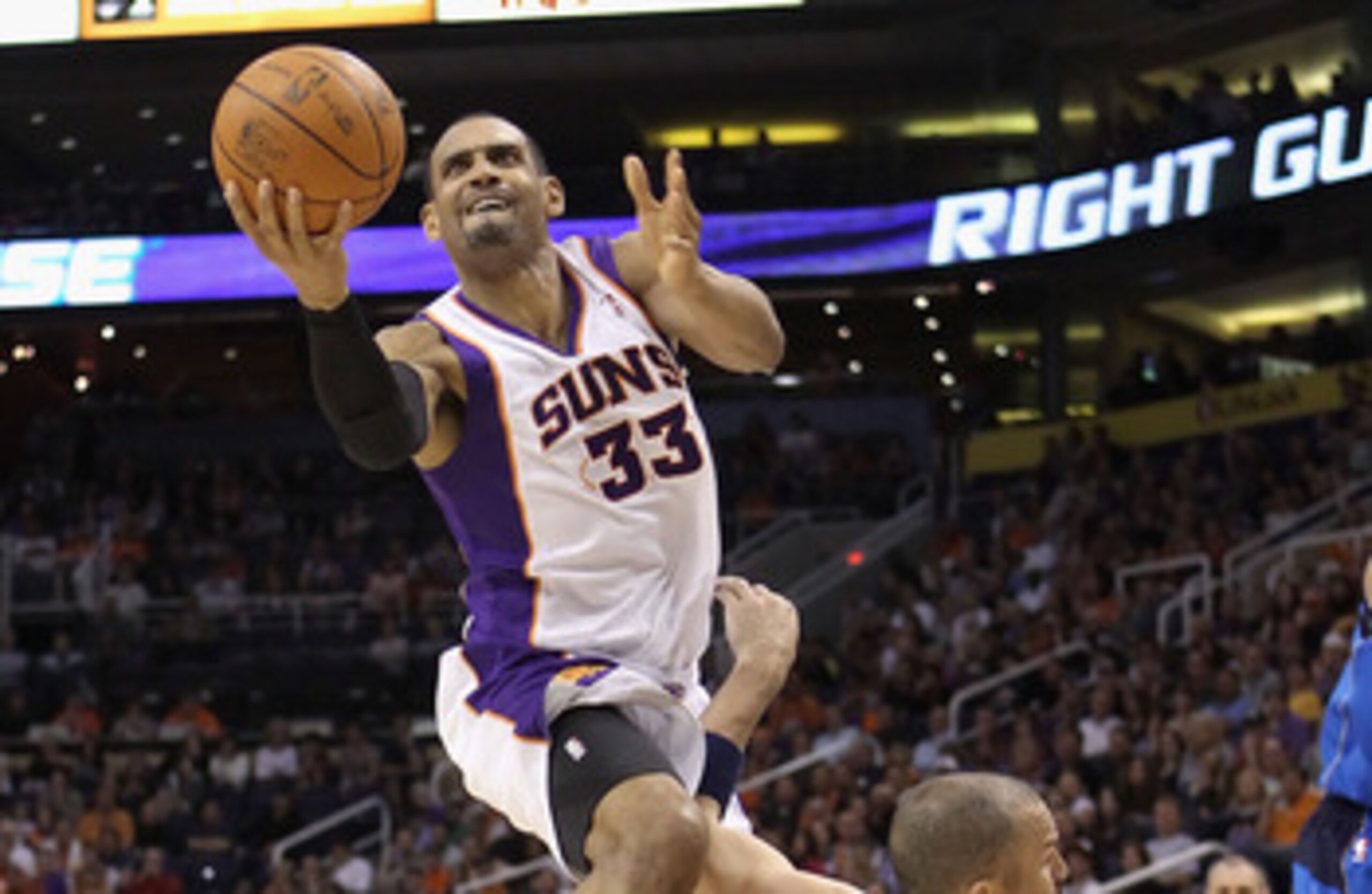 PHOENIX, AZ - MARCH 27:  Grant Hill  #33 of the Phoenix Suns attempts a shot over Jason Kidd #2 of the Dallas Mavericks during the NBA game at US Airways Center on March 27, 2011 in Phoenix, Arizona.  The Mavericks defeated the Suns 91-83.  NOTE TO USER: 