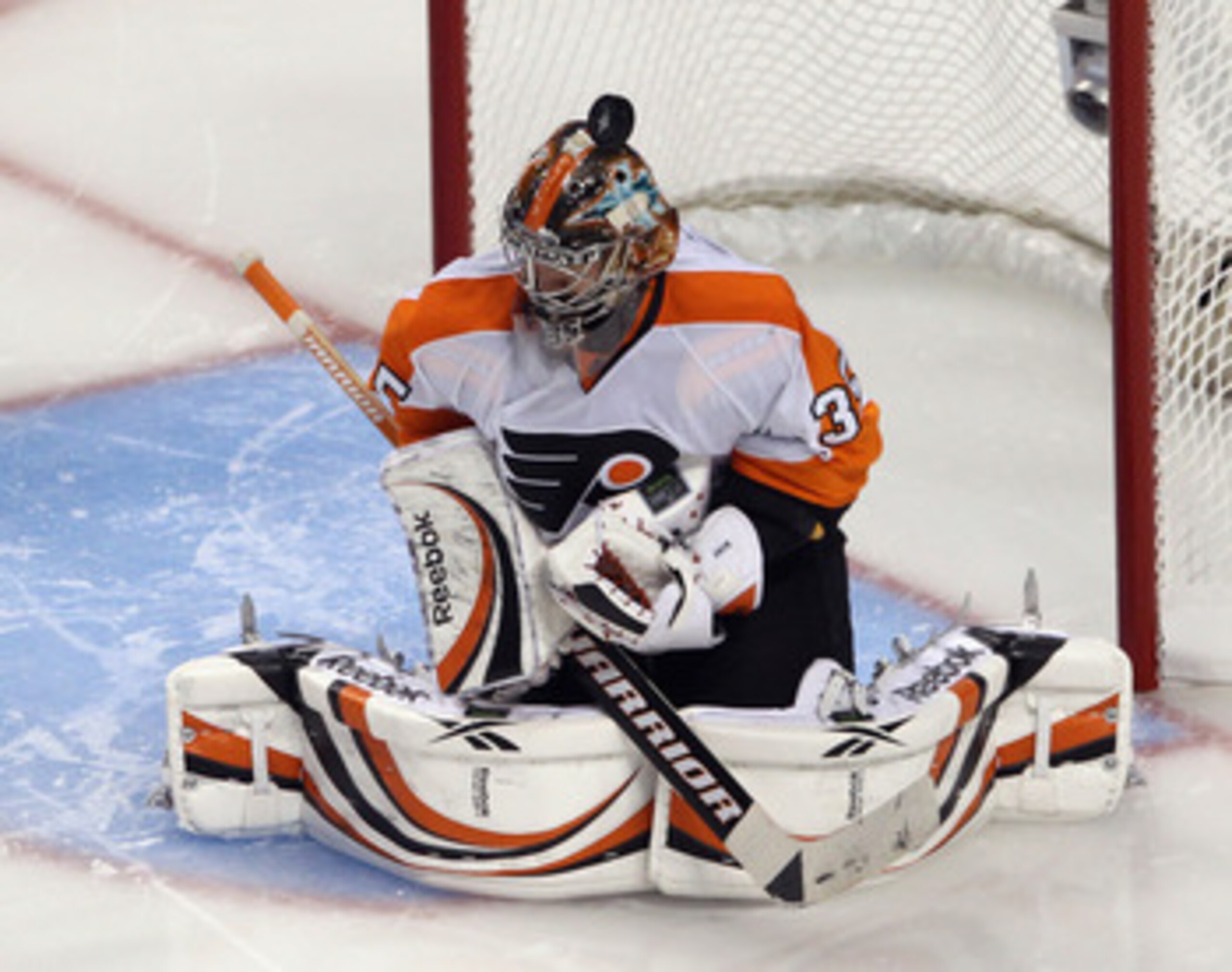 BOSTON, MA - MAY 06: A puck bounces off the helmet of Sergei Bobrovsky #35 of the Philadelphia Flyers during his game against the Boston Bruins in Game Four of the Eastern Conference Semifinals during the 2011 NHL Stanley Cup Playoffs at TD Garden on May