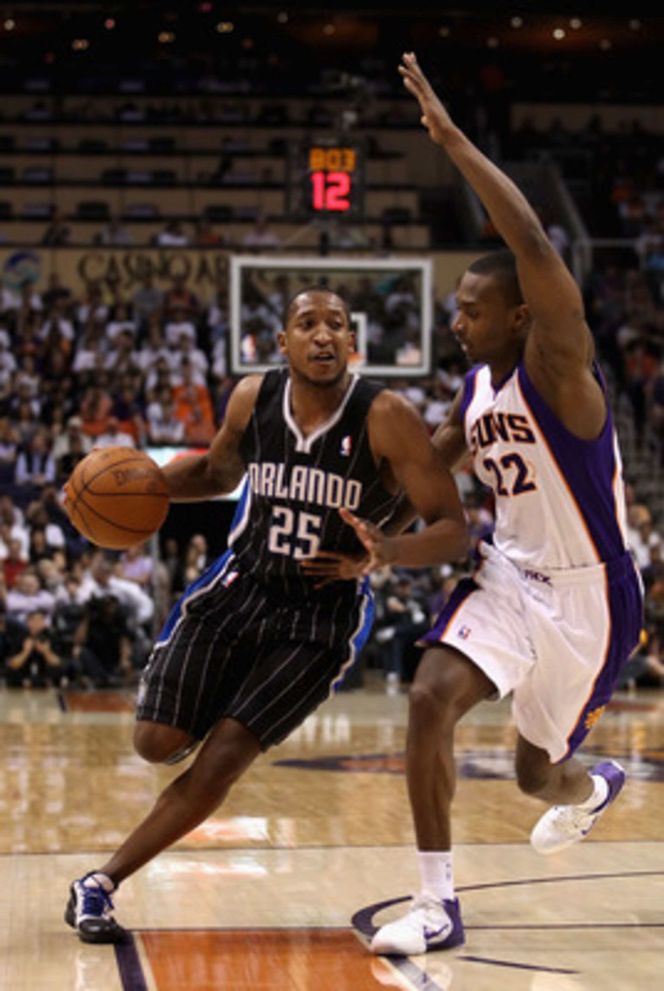PHOENIX, AZ - MARCH 13:  Chris Duhon #25 of the Orlando Magic handles the ball during the NBA game against the Phoenix Suns at US Airways Center on March 13, 2011 in Phoenix, Arizona. The Magic defeated the Suns 111-88. NOTE TO USER: User expressly acknow