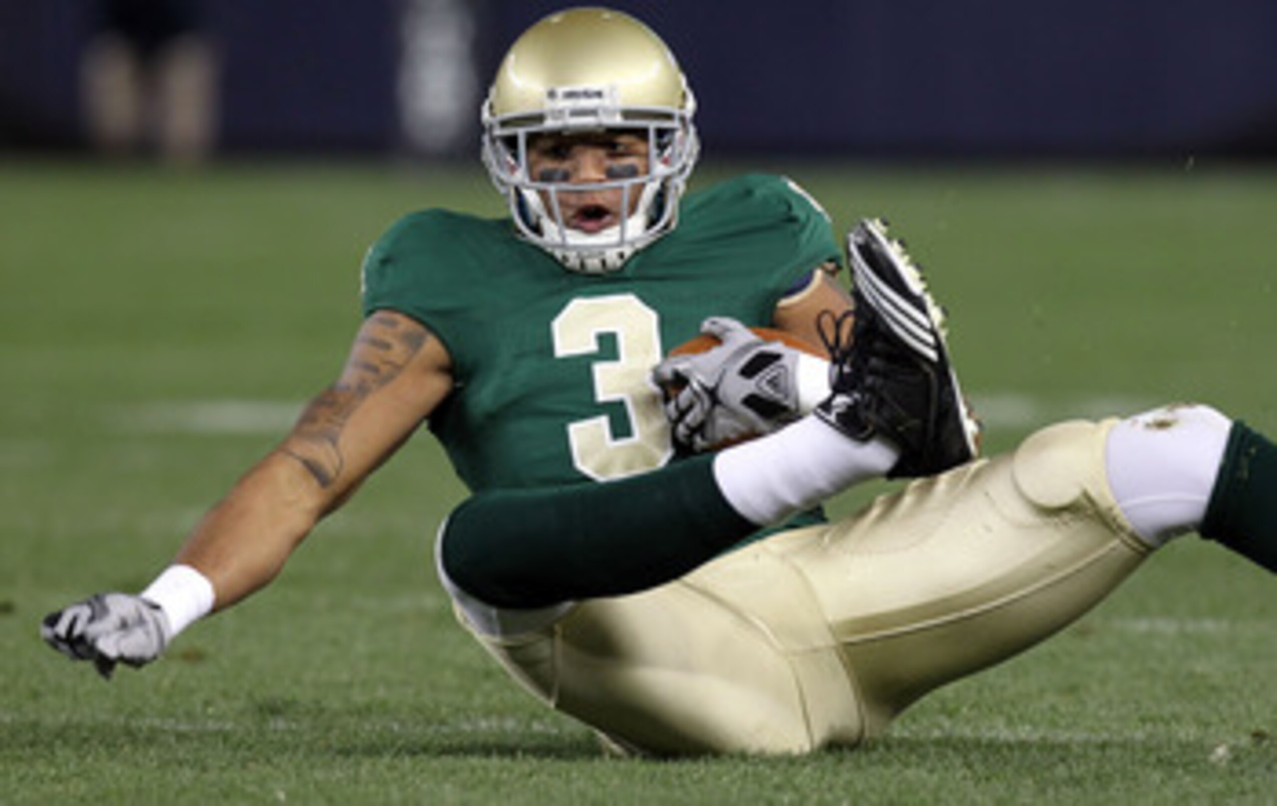 NEW YORK - NOVEMBER 20:  Michael Floyd #3 of the Notre Dame Fighting Irish loses his footing against the Army Black Knights at Yankee Stadium on November 20, 2010 in the Bronx borough of New York City.  (Photo by Nick Laham/Getty Images)